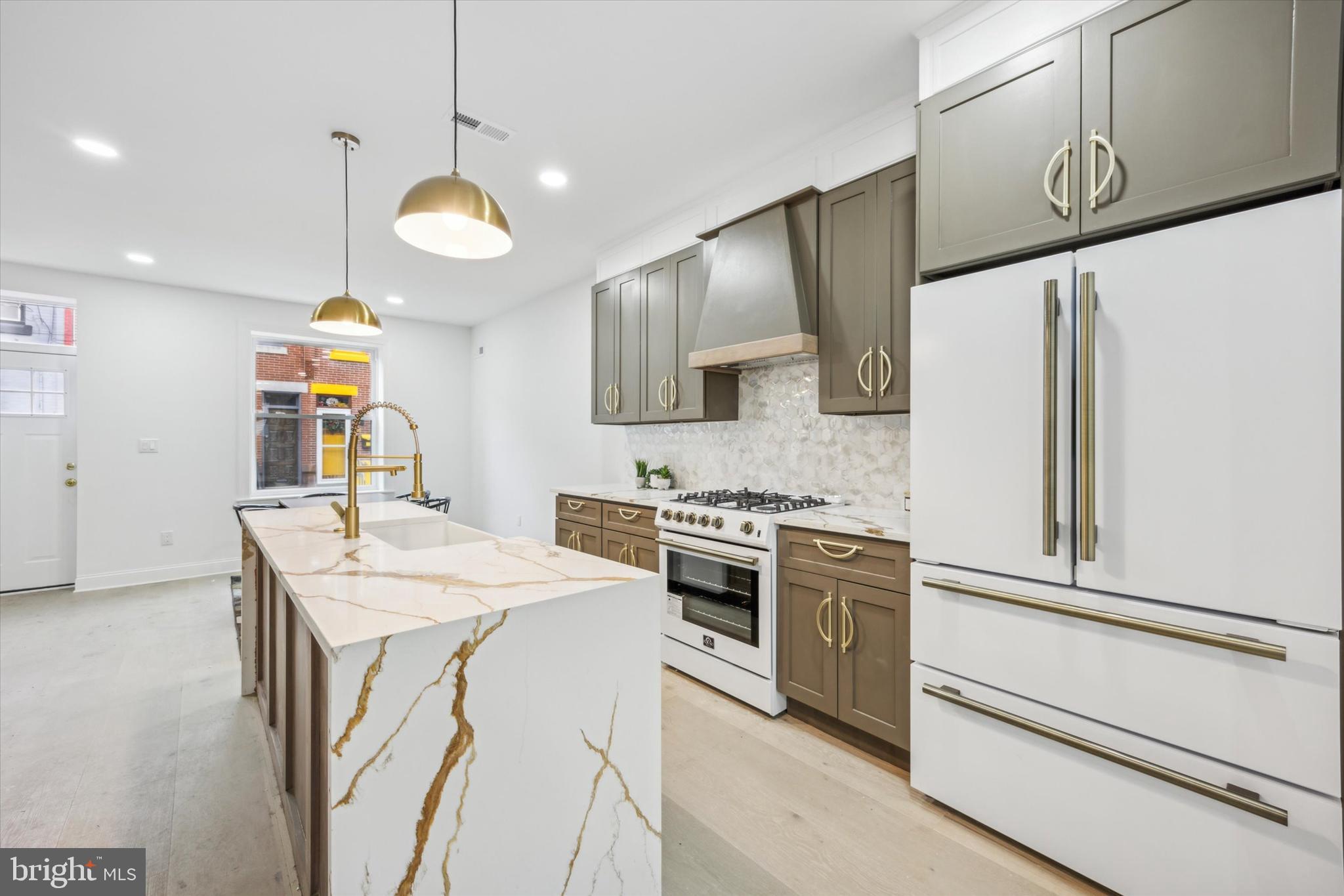 Welcome to 2427 Kimball St, a remarkable home nestled in the heart of Philadelphia's vibrant Graduate Hospital neighborhood. Prepare to be captivated by this recently renovated 3-story gem with 2 large private outdoor spaces. With 3 spacious bedrooms, 3 sleek bathrooms, and an impressive 2,200+ square feet of living space, this home is an absolute showstopper.
 
As you enter, the abundance of natural light streaming through the open concept living and dining areas is striking, while an inviting fireplace beckons you to cozy up and unwind. The designer kitchen is a culinary dream, featuring a stunning white chef's commercial range with gold accents, quartz countertops, and ample cabinet space. It's the perfect spot to whip up delicious meals and entertain guests. In addition, the first floor offers a large dining and living space that flows seamlessly into a significant outdoor area, creating the ultimate indoor-outdoor living experience. Upstairs on the second floor, you'll discover two generously sized bedrooms and one bathroom, offering its own unique charm. The primary bedroom is a sanctuary, featuring a luxurious en-suite bathroom, complete with a wet room, freestanding soaking tub, and a spa-style shower. Additionally, a large walk-in closet provides ample storage space. This private oasis on the roof deck is the perfect place to unwind, soak up the sun, and relish in the breathtaking views that surround you. But that's not all! This extraordinary home also offers a finished basement with a full bathroom, providing even more versatile living space. 
 
Conveniently located just steps away from Philadelphia's finest restaurants, cafes, and shops, this home offers the perfect blend of city living and modern luxury. With easy access to local hospitals, you'll have everything you need right at your fingertips, while also enjoying a 10-year tax abatement and a 1-year builder warranty! Don't miss your chance to call this stunning property your new home. Schedule a showing today and embark on a new chapter of luxurious city living at 2427 Kimball.