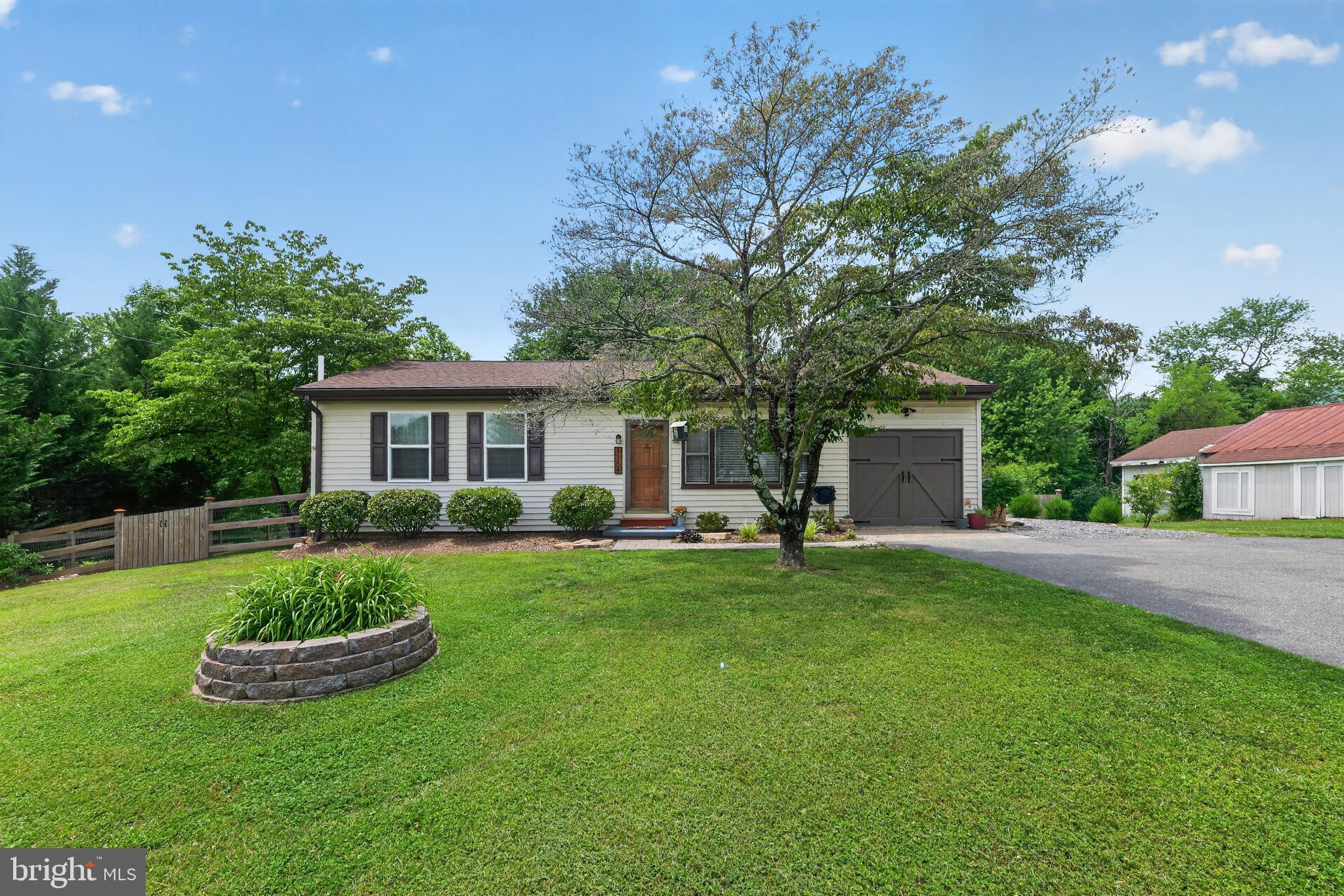 Beautifully updated 3 bedroom, 1 bathroom ranch home. Trendy and modern finishes applied throughout to include an open fully renovated kitchen, refinished hardwood floors, and built in fireplace. Sunlit dining area off of the kitchen provides ample views of nature in the serene backyard. Carpeted bonus space off of the main living area would function well as a home office, bonus space,  or kid's playroom. Aesthetically pleasing sliding door leads to an unfinished basement providing a large amount of storage with the potential to finish as you like, complete with bathroom rough-in. Continue past the driveway to a side deck which provides a separate entrance and drop zone. Private fenced backyard with mature trees providing shade, unwind with a fire pit. Recently replaced hot water heater within 2 years, radon mitigation system, water softener, water neutralizer, vinyl siding and BRAND NEW architectural shingle roof complete with new gutters and guards. Well cared for HVAC and septic. Easy access to commuter routes of Rt 15, I-70 AND I-270. Conveniently located close to the charming restaurants & shopping of Downtown Frederick and beloved Baker Park with no city taxes or HOA! Come see it before its gone!