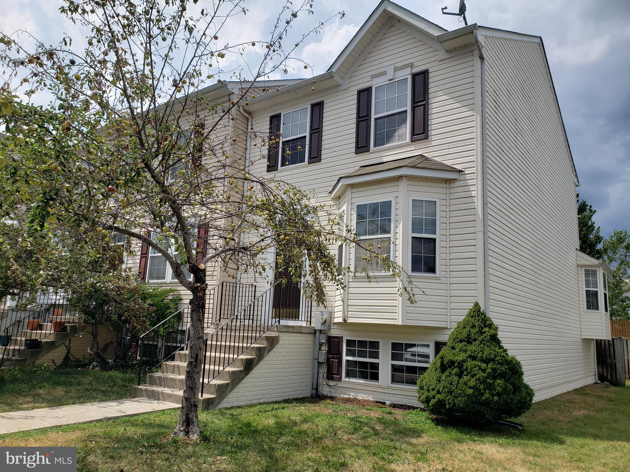 END UNIT with Fenced Back Yard.  New Carpet.  Fresh Paint inside & out.  New Kitchen Floor.  New Washer & Dryer on the way.  Basement with Full Rough In and more room to finish your way.