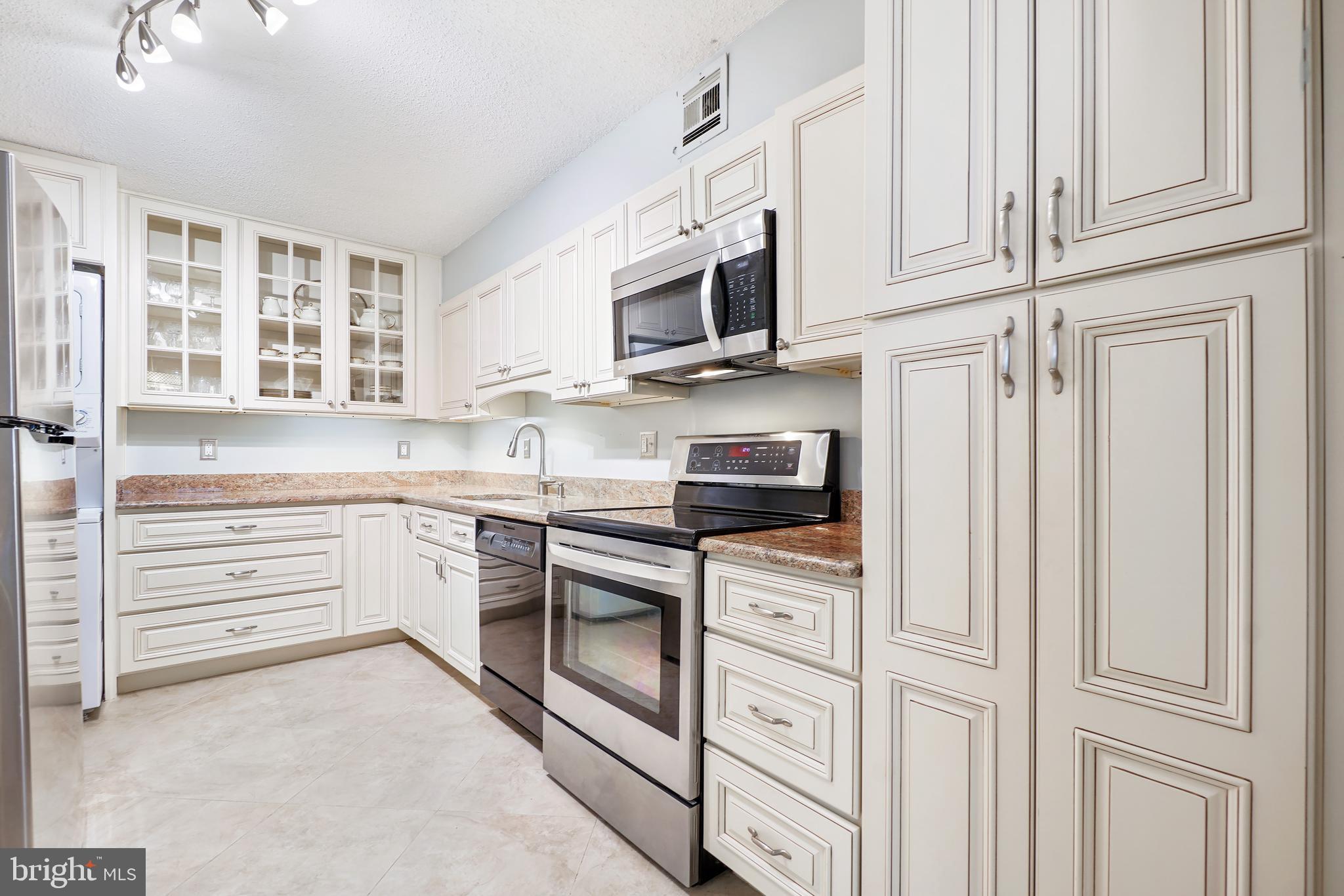***** SOLD/CLOSED/SETTLED. ***** WELCOME HOME to 5903 MOUNT EAGLE DRIVE, #312 at MONTEBELLO, -- the area's premier "AWARD-WINNING" luxury condominium! •1-BEDROOM/1-BATH MONTEBELLO HOME PLUS SUN FLORIDA ROOM/SCREENED PORCH: One of the most desirable floor plans w/generous room sizes and nice flow throughout. Premium building location overlooking wooded/treed setting, with autumn/winter views of the Alexandria City skyline and Masonic Temple, w/the nighttime views being especially spectacular! •MOVE-IN-READY/NUMEROUS UPDATES AND IMPROVEMENTS: Features completely renovated kitchen and bath, upgraded sun/Florida room enclosure, HVAC, custom plantation shutters, lighting, freshly painted and more. •WELCOMING ENTRY FOYER: Features extra-large coat closet, plus a second large walk-in storage closet. •LIVING ROOM: Extra spacious w/plenty of wall-space for optimal placement of sofa and entertainment center, w/direct access to the sun/Florida room. •SUN/FLORIDA ROOM/SCREENED PORCH: Extends and opens up directly from living room offering additional "year-round" living space w/RADIANT HEATED FLOORS. This room is VERY PRIVATE, -- being one of only three floor plans w/the added privacy w/no views of neighboring units! Overlooks Montebello's woodlands and walking nature trails below. Receives abundant sunshine being especially ideal for pets and plants. Features tiled floors and ceiling fan/light. ***** Entire glass enclosure previously replaced and upgraded, -- A $20,000 ADDED VALUE! ***** •SEPARATE DINING ROOM: Extra-large, easily accommodating table/seating for 6 or 8 and china cabinet and buffet. •KITCHEN: Completely renovated featuring upgraded cabinetry including glass cabinetry, upgraded beveled granite countertops, flooring, appliances, and lighting. Very practical and functional layout w/plenty of workspace. PLUS, an added wall of extra cabinets and countertops space! •PRIMARY/MASTER BEDROOM: Exceptionally spacious as is the adjoining extra-deep and wide walk-in closet. Plenty of wall-space for placing king-size bed, furniture, and sitting area. •PRIMARY/MASTER BATHROOM: Full bath completely renovated. Featuring upgraded extra-tall vanity w/beveled granite countertops, heavy-duty bathtub/shower w/marble-like tiled walls to ceiling, tiled floors in polygon pattern, and upgraded sconce lighting and faucet fixtures. •LAUNDRY: Washer/dryer in unit. PLUS, the building offers an extra-large commercial washer/dryer for over-sized items. •HVAC AND UTILITIES: Brand-new upgraded Carrier HVAC system in 2022 w/semi-annual inspection included in condo fee. Hot/cold water also included, electric billed separate w/Dominion Energy, and Verizon FIOS and Cox for internet, TV, and landline phone.  •EXTRA-STORAGE! Building 5903, Level B2, Storage Room 10, Bin #312. •PARKING: More than ample parking, usually within 50 to 200 feet of the building. PLUS, electric vehicle (EV) charging stations!