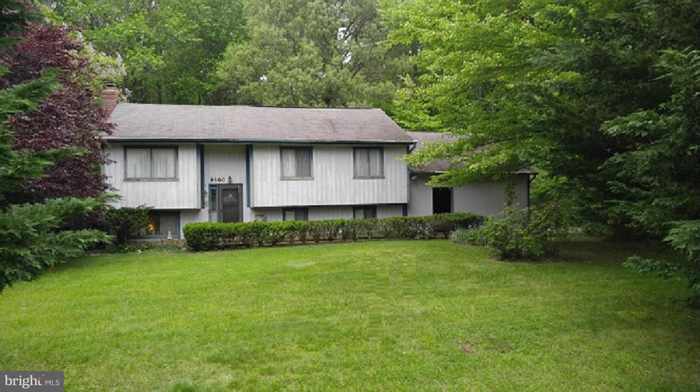 ESTATE RELOCATION! This is not a Short Sale! 4Bdr/2Bath, Split foyer, Cathedral Ceiling, Large Basement w/ Rough-in and Fireplace, 8'x40' Rear Deck with lots of privacy, Tranquil Setting on quiet street with Mature Trees on one full acre. Home has lots of room and update potential. 1 yr Home Warranty with extra coverage, Closing Help, and Update Allowance available.