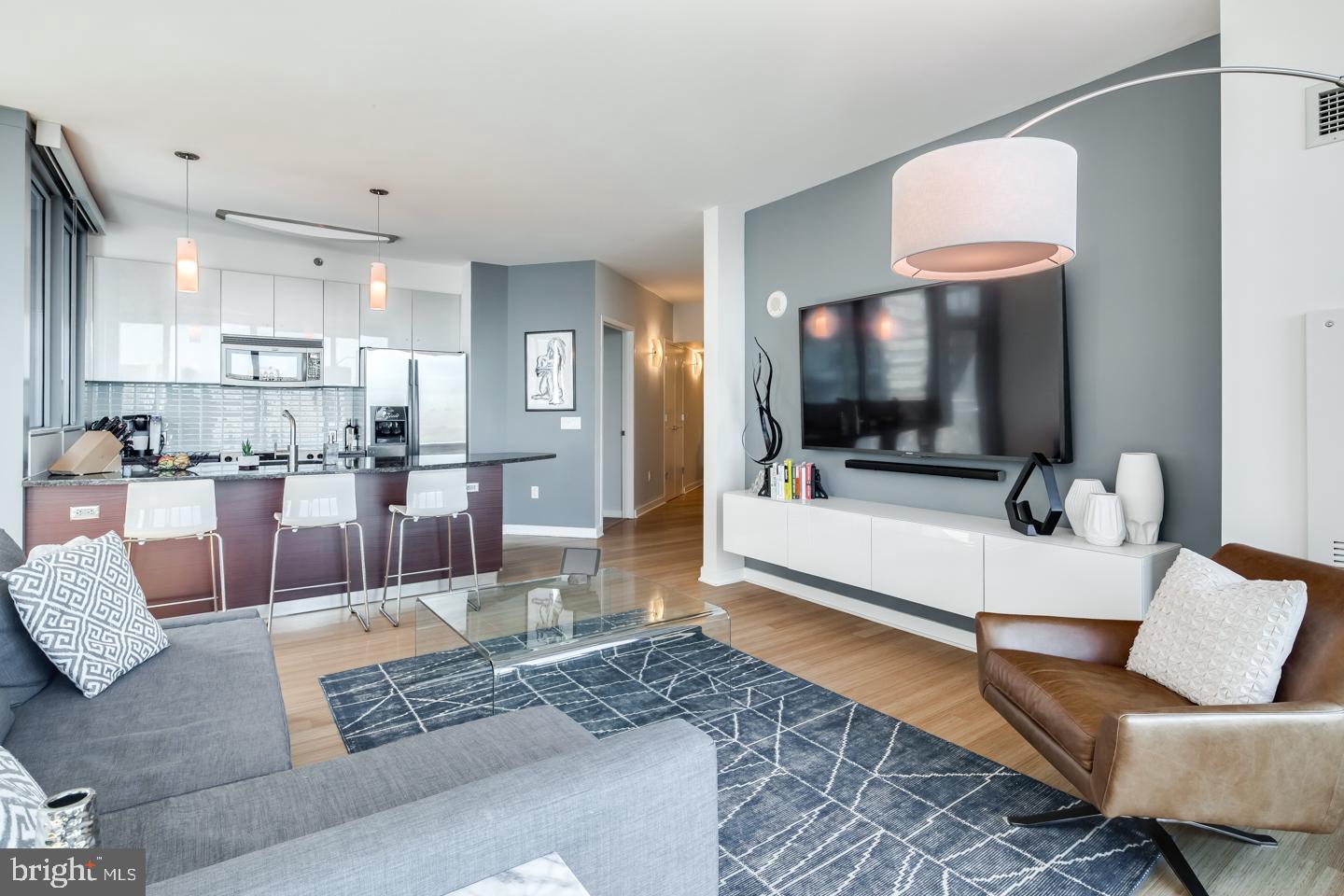 A spacious and luxurious condominium with amazing North and West facing views. This 2-bedroom, 2-bath residence features modern and luxurious finishes including granite countertops, title floors, stainless steel appliances, 9-foot ceilings with floor to ceiling windows. The price includes a reserved parking space in the attached covered garage, and a storage locker. The building features a 24HR Concierge, fitness center, a heated 60FT lap pool, renovated sundeck/community room and much, much more! The building is situated conveniently next door to Trader Joes and Wine & Spirits - and is just walking distance from Philadelphia's top-rated restaurants. Spend the day shopping in Rittenhouse, or enjoying the sights at Boathouse Row, you can't beat the location and attractions located right near the Murano! Don't miss out on this unit