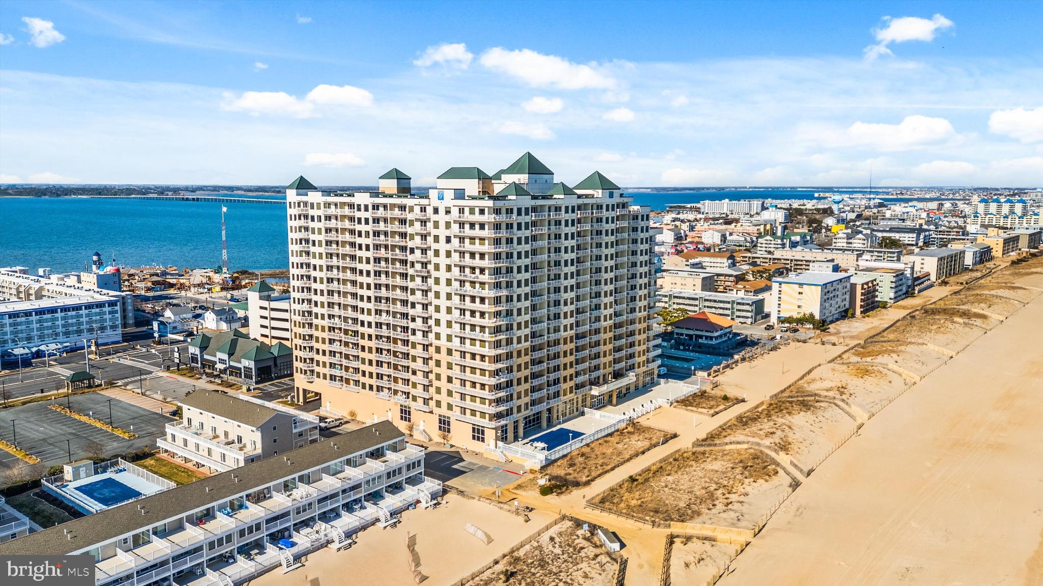 Experience luxury oceanfront living at its finest from the 7th floor of one of the most desirable buildings in all of Ocean City, Maryland — the prestigious Gateway Grand. Built in 2008 and known for its exceptional maintenance, upscale amenities, and strong management, this premier mid-town oceanfront community offers the lifestyle buyers dream about.
This spacious 3-bedroom, 3 full bath direct oceanfront residence is currently the only direct oceanfront unit available in the building, making it a rare opportunity to own in one of Ocean City’s most sought-after addresses. Offered fully furnished, this beautifully maintained condo is move-in ready and perfectly positioned to enjoy breathtaking panoramic ocean views from the comfort of your living space.
What truly makes this unit stand out is that all three bathrooms have been upgraded with beautifully tiled walk-in showers instead of standard bathtubs, creating a more modern, luxurious, and elevated feel throughout the residence.
The Gateway Grand is a high-end luxury building offering all of the amenities buyers are looking for in a beach condominium, including heated indoor and outdoor pools, a 24/7 fitness center, kid’s game room, elegant two-story glass lobby, party room, secure access covered parking garage with an abundance of parking and electric car chargers, additional surface parking, on-site maintenance team, on-site management, and a staffed front desk with overnight security.
Owners also enjoy access to the beach club located right next door, and this unit additionally conveys with a Seacrets VIP card — a unique bonus that adds even more to the ultimate Ocean City lifestyle experience. This condo also comes with a generously sized ground-level storage locker (#82), perfect for all of your beach gear and personal storage needs.
Perfectly located in mid-town Ocean City, you are surrounded by some of the area’s best dining, entertainment, shopping, and nightlife. Whether you are searching for a premier second home, luxury investment property, or full-time residence by the ocean, this is coastal living at another level.