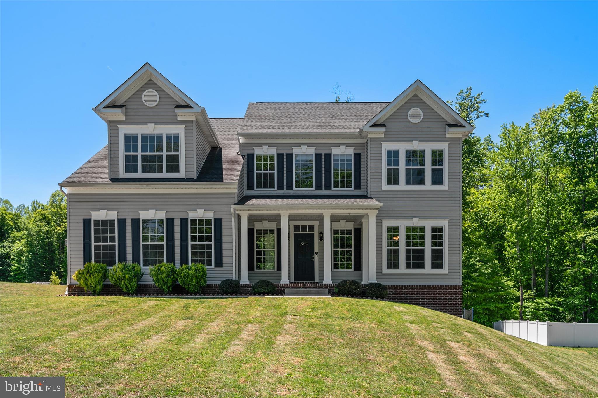 2.75% ASSUMABLE VA LOAN. 3202 Elwood Lane is a CUSTOM MASTERPIECE in the highly sought after Marley Run Community, offering nearly 5,000 square feet of refined, modern living. The journey begins in a soaring two-story foyer where natural light highlights the engineered HARDWOOD floors that flow across the main and upper levels. This floor plan is designed for versatility, featuring a main-level 3/4 bath with a custom-tiled shower and a flexible front room ideal for a home office, playroom, or formal dining. The home’s true centerpiece is the massive 30x25-foot gourmet kitchen, a culinary sanctuary equipped with a reverse osmosis water system, wine refrigerator, walk-in pantry, and MASSIVE QUARTZ-TOPPED ISLAND AND PENINSULA, each offering added space for eat-in dining. The spacious window-draped morning room that adjoins the kitchen leads outside to a premium composite deck. Rounding out the open-concept main level is a sun-drenched family room anchored by a 36-inch gas fireplace with a slate surround.
 
Upstairs, the luxury continues in the EXPANSIVE OWNER’S SUITE, which offers a private sitting area, deep walk-in closet and a SPA-INSPIRED BATH featuring an oversized 5x5-foot dual-head shower, soaking tub, and split sinks. Just outside the primary bedroom is an optimally-placed laundry room complete with a utility sink and linen closet. Three additional bedrooms await upstairs alongside a beautiful full bath with a double sink vanity. The walk-out lower level is an ENTERTAINER’S DREAM, finished with durable luxury vinyl plank flooring. It features a dedicated home gym, large wet bar, family room, and a private fifth bedroom suite with an attached bathroom and yet another custom-tiled shower, making it ideal for multi-generational living or extended guests.
 
This house is as efficient as it is elegant offering a seamless blend of sophistication, comfort, and elevated everyday living. With SELLER-OWNED SOLAR PANELS and a FULLY PREPAID FRONT FOOT FEE, the home offers THOUSANDS of dollars in immediate and long-term savings. Technical upgrades abound, including NINE-FOOT CEILINGS ON ALL LEVELS, hardwired ethernet in every room and on the deck, and a 240-volt EV charging station in the garage. Positioned within a top-ranking school district with effortless access to commuter routes 2 and 4, this property provides a rare combination of high-tech infrastructure and modern style.