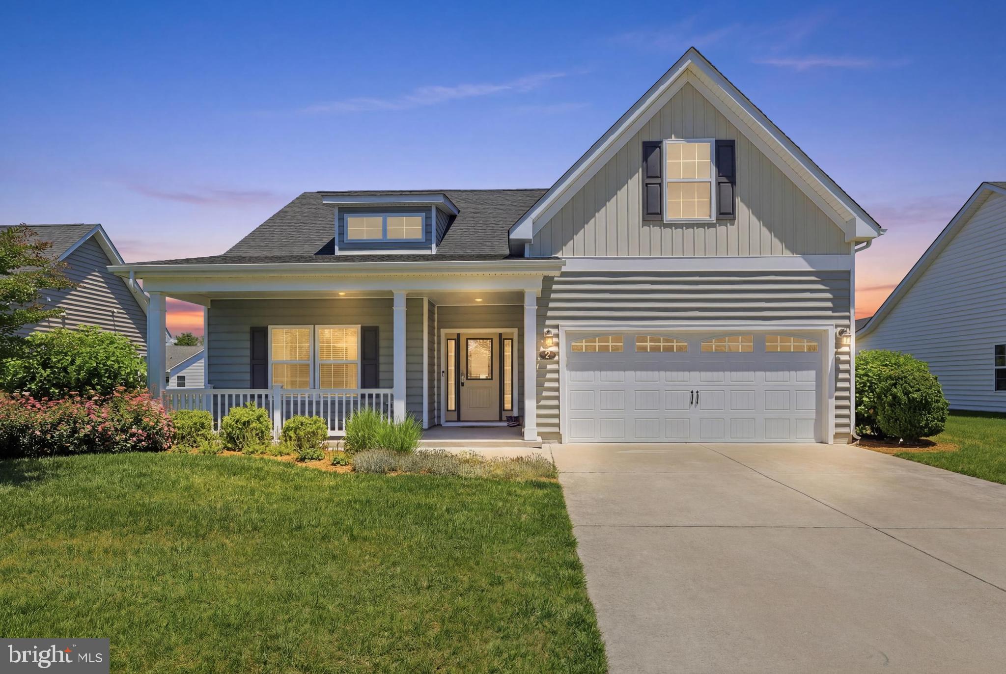 Rare opportunity in The Village of Cinderberry!  This immaculate 3BR/2BA ranch is situated on a premium lot overlooking the community pond.  The open concept design features 1670 square feet of living space, and provides an opportunity to downsize without sacrificing functional living space or storage.  Wide-plank hardwood flooring extends from the foyer into the open concept kitchen, living room, and dining room.  The well-appointed kitchen includes 42-inch maple cabientry with granite counters, a large island with pendant lighting and breakfast bar, roll out shelving, stainless steel appliances, gas range, and a pantry closet.  The living room features a gas fireplace that is flanked by windows with pond views and also includes a wall-mounted flatscreen TV.  This home was built with the optional dining room bump-out which provides additional square footage and a wall of windows that flood the dining space with natural light.  Enjoy outdoor relaxation on the covered front porch or listen to the peaceful fountains in the pond from the three-season porch with Eze-Breeze vinyl windows.  The owner's suite includes a spacious walk-in closet with built-in organizers, and a full private bath with tile flooring, tile shower, linen closet,  and a large vanity with practical counter space.  The secondary bedrooms are thoughtfully located on the opposite side of the home near the well-appointed guest bathroom.  Other highlights of this turn key home include a spacious two-car garage with built-in shelving, laundry room, tankless water heater, ceiling fans, recessed lighting, window treatments, security system, and reverse osmosis water filtration.  Monthly HOA fees include lawn and flower bed maintenance, exterior home maitenance, and snow removal including driveways.  Community amenties at the clubhouse include a heated indoor pool, exercise equipment, a library, and meeting space for both personal and community activities.  The Village of Cinderberry is conveniently located east of Route 113 in Georgetown, approximately 30 minutes from the Delaware Beaches!  Several listing images of interior rooms include virtual staging.
