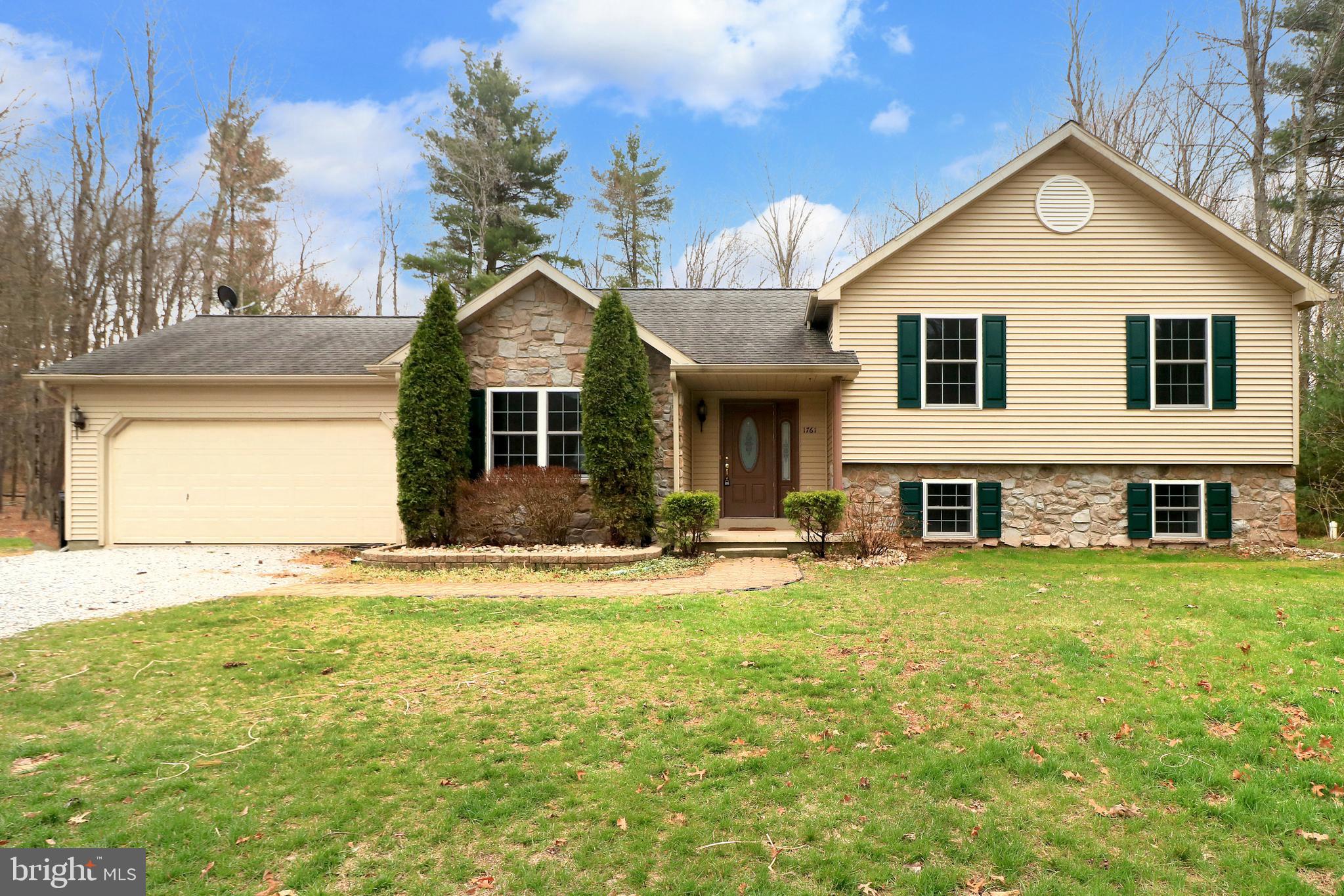 Nestled on 2.18 private acres, this stunning 3-bedroom, 2-bathroom home offers the perfect blend of modern comfort and serene country living. With an inviting stone-accented exterior, charming covered entryway, and lush natural surroundings, this property is ideal for those seeking both privacy and convenience. Step inside to discover a spacious and thoughtfully designed interior, featuring a large primary suite with a private en-suite bath, two additional bedrooms, and two versatile bonus rooms—perfect for a home office, gym, or guest space. A generously sized rec room provides endless possibilities for entertainment, movie nights, or a play area, along with a propane fireplace. The heart of the home boasts a bright and open kitchen, equipped with stainless steel appliances, ample cabinet space, and a reverse osmosis water system for crisp, clean drinking water. The open-concept design flows seamlessly into the dining and living areas, creating an inviting space for gatherings. Enjoy year-round comfort with a brand-new high-efficiency furnace, ensuring warmth and energy savings during colder months. When it's time to unwind, step outside onto the covered back deck, where you can take in the peaceful wooded surroundings—perfect for morning coffee or evening relaxation. This home offers the ideal balance of modern updates, ample space, and peaceful surroundings. Don’t miss this incredible opportunity—schedule your private showing today!