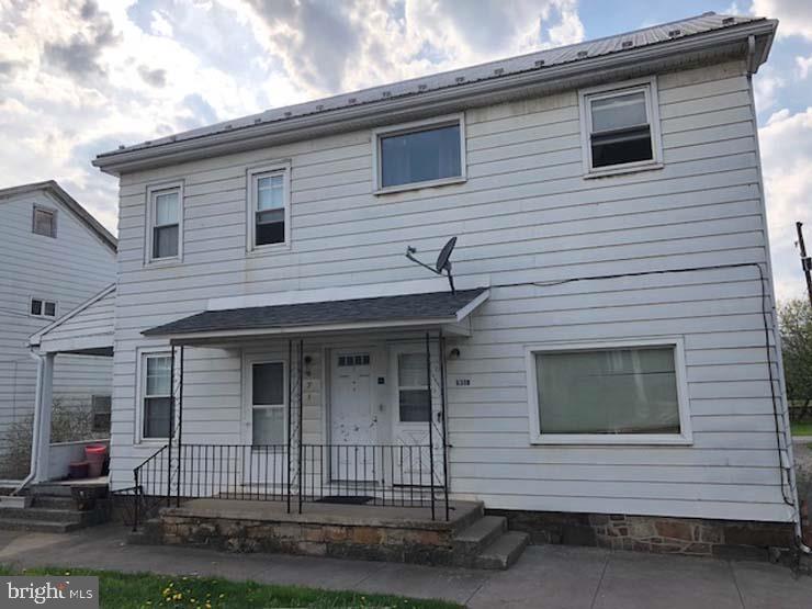 Well maintained 4 unit multi-family investment property. Live in one unit & let tenants help pay mortgage. Each unit equipped with washer & dry hookups & electric heat. Apartment A in 2013 w/insulating walls & floors & new carpet in 2014. All carpets have been treated w/ stain guard. All units have garbage disposals, thermal pane tilt-in windows. All doors insulated w/storm/screen doors. 3 units have new 1.8 gal flush of comfort toilets.  Off street parking in rear of unit.