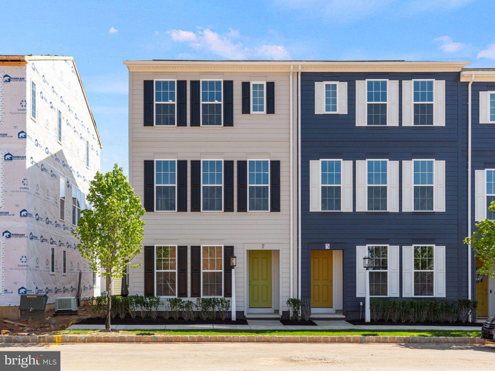Move right into this striking end townhome in Grange, where thoughtful design and elevated finishes come together in a home that feels both sophisticated and welcoming. Offering 3 bedrooms and 3.5 baths, this move-in-ready home is filled with natural light, soaring 9-foot ceilings, and an open-concept main level designed for effortless everyday living. At the center of the home, the chef-inspired kitchen makes a statement with rich slate cabinetry, sparkling granite countertops, a full-wall tile backsplash, stainless steel gas appliances, and a sleek black faucet for a bold designer touch. The oversized eat-in island creates the perfect gathering place for casual meals, conversation, and entertaining alike. Upstairs, the tranquil primary suite offers a private retreat complete with a spa-like tile shower and generous walk-in closet. A second bedroom with its own en-suite bath provides ideal flexibility for guests, family, or a quiet workspace. The finished lower level adds even more versatility, featuring a spacious mudroom and entry foyer leading to a third bedroom and full bath—perfect for overnight guests, a home office, fitness room, or multigenerational living. Nestled in the heart of the Cumberland Valley, Grange features preserved spaces including a wildflower meadow, green areas shaded by century-old trees, walking trails, and gathering spots perfect for connecting with friends old and new. This home is eligible for special incentives. Contact us for more details.
