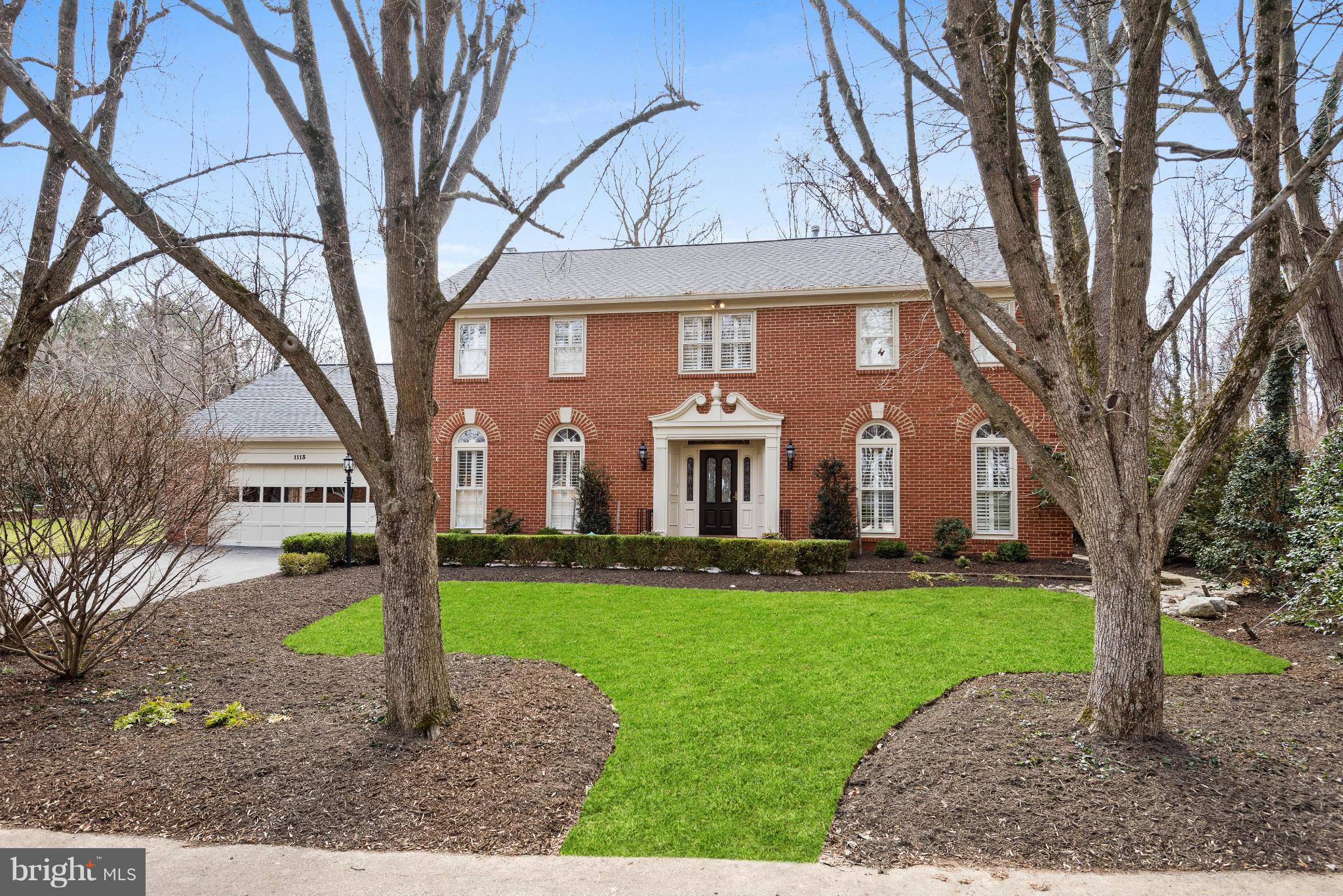 Handsome all brick colonial backing to parkland offering almost 6000 sf of living * Beautifully updated & renovated on all three levels * Top of the line gourmet kitchen opening to family room * Luxury Master Suite * Hardwoods on main & upper levels * Three fireplaces * Private backyard with flagstone patio *  Complete lower level w/kitchenette * Surrounded by acres of parkland with walking paths