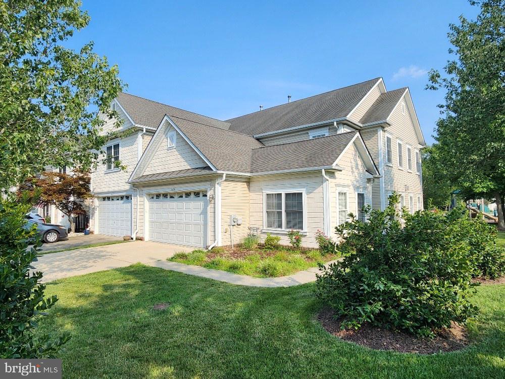 This could be your chance to have that low maintenance townhouse in a waterfront/access and boaters' community. This townhouse boasts a primary bedroom on the main floor, with a large ensuite and walk-in closet. The tastefully appointed kitchen features granite counter tops, some updated appliances, and its central location on the main floor ensures you can fully engage with your family and guests in the living room and dining area.  The dining area and living room are separated by a double-sided gas fireplace to keep you warm on those cold winter nights. The main floor also has a den that can be used as flex space for an office, or a bedroom. On the upper level you'll find a loft that overlooks the front entry, and may be perfect for game night, reading, or other activity.  The second level also has two decent-sized bedrooms separated by a full bath, and if you're concern about storage, there is an abundant amount of storage space just off the loft. You will also appreciate the 2-car garage and entry into the mud/laundry room from the garage. For those not familiar with the Solomons area you'll find a variety of activities to including hiking, biking, boating, fishing/crabbing, among others. AnnMarie Sculpture, the Calvert Marine Museum, and multiple restaurants await your dining pleasure.