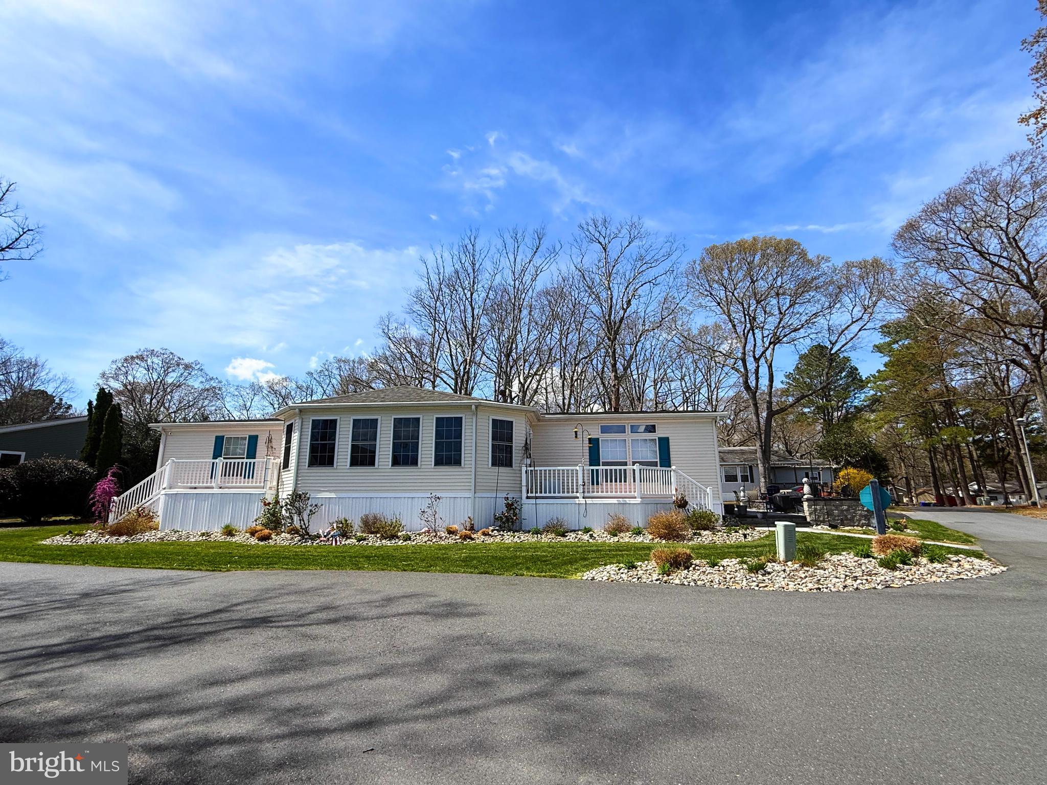 Located in the desirable Pot-Nets Bayside community, this beautifully maintained 3 bedroom 2 bathroom home offers approximately 2,108 square feet of upgraded living space.

The spacious kitchen features quartz countertops, custom tile backsplash, under and above cabinet lighting, custom fixtures, a beverage cooler, toe kick drawers, and a heavy duty KitchenAid mixer lift. Luxury vinyl plank flooring runs throughout the home.

Enjoy a bright four season room and a comfortable living area with an electric fireplace. A built in bar with wine cooler adds the perfect space for entertaining.

Bedrooms include custom closet organizers and built in storage, while bathrooms feature bench seating in the showers.

Outdoor living includes a patio with fire pit and grill area overlooking the pond. The property also offers a two car garage and two drive ways.
New HVAC and hot water heater. Sold turn key, comes completely  furnished, excludes  personal items. Land lease $1,598.