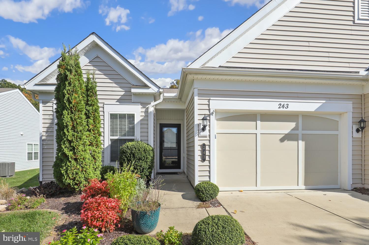 Welcome home to 243 Long Point Dr, this Beautiful end unit villa in the Celebrate Virginia North neighborhood. Celebrate by Del Webb is a 55+ active adult community that is loaded with amenities. This home has so many upgrades including granite countertops in the kitchen, tons of cabinets, pantry, stainless steal appliances, ceramic backsplash and ceramic tile floors. This 2 bedroom 2 bath home features an open floorplan for the kitchen, dining area and family room, which also has a gas fireplace. Off the kitchen you'll find a private study with double doors. The main living areas have beautiful hardwood floors, both bedrooms are carpeted with ceramic tile floors in both bathrooms. The primary bedroom is spacious with a huge window and the primary bath features a double vanity, upgraded glass shower doors and a large walk-in closet. This home also has an amazing screened in porch off the back to enjoy!!  The community has so many amenities to enjoy including the Lodge offering 30,800-square-foot of physical and social activities. It has a fitness center with state-of-the-art exercise equipment, an indoor pool and spa, track, hobby and craft rooms, a ballroom, billiards room, and a library. On a beautiful day enjoy the outside tennis courts, bocce ball courts, putting green, and trails.