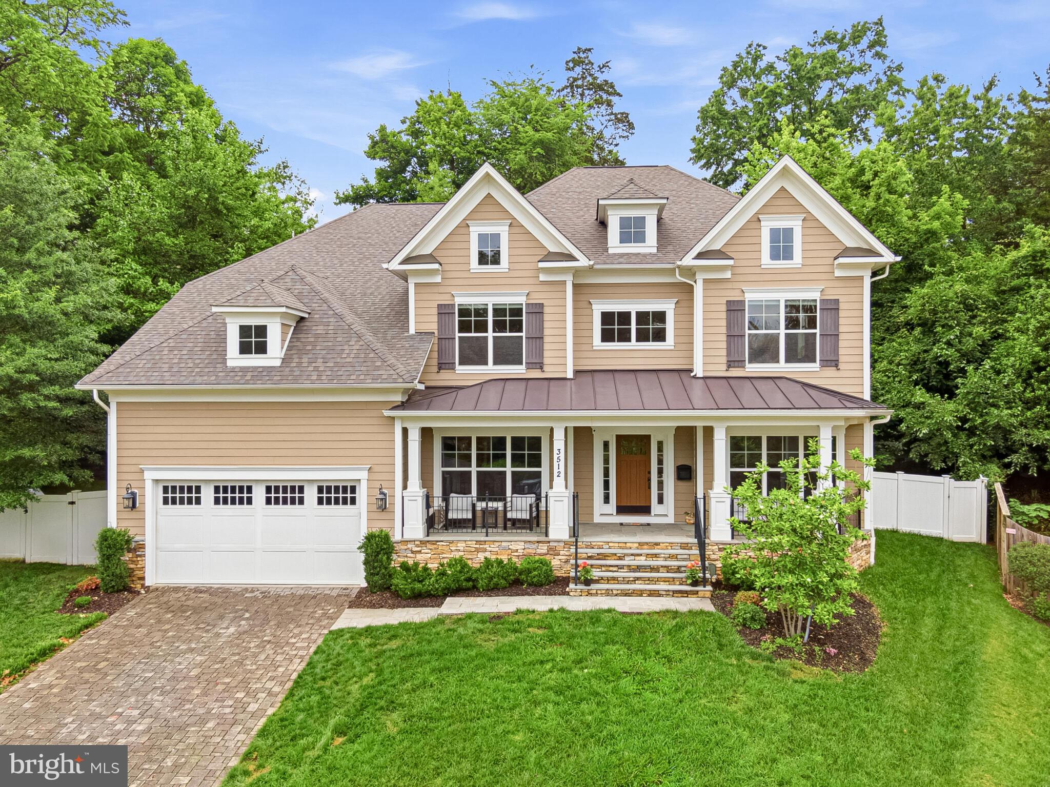 Welcome to this stately home offering over 7100 square feet of beautifully finished living space, thoughtfully designed for both elegant entertaining and comfortable everyday living. A grand foyer with soaring double-height ceilings creates a striking first impression and is flanked by a formal living room ideal for greeting guests and a sophisticated dining room complete with a butler’s pantry that seamlessly connects to the kitchen and family room.

The main level also features a designer powder room and an expansive private office that can easily function as a main-level bedroom. At the heart of the home is the open-concept family room and gourmet kitchen, perfectly suited for modern living. The kitchen showcases extensive white-on-white cabinetry and countertops, a large center island with seating, stainless steel appliances, generous table space, and the convenience of two dishwashers.

Upstairs, accessible by both front and rear staircases, are four spacious bedrooms, each with its own en-suite bath. Secondary bedrooms feature walk-in closets and dedicated desk or study areas. The luxurious primary suite is a true private retreat, offering a sitting area, enormous walk-in closet, and spa-inspired bath with dual vanities, abundant storage, a separate soaking tub, and an oversized glass-enclosed shower with multiple shower heads.

The fully finished lower level expands the home’s versatility with a fifth bedroom, hallway bath, large recreation room, fitness room, two storage rooms, and an unfinished theater room already roughed-in for a future wet bar.

Outside, the fully fenced backyard offers exceptional privacy and easy maintenance, complete with a pool and separate play area. Truly a rare offering for buyers seeking estate-style living with privacy, luxury finishes, and an exceptional location within sought-after Arlington schools.