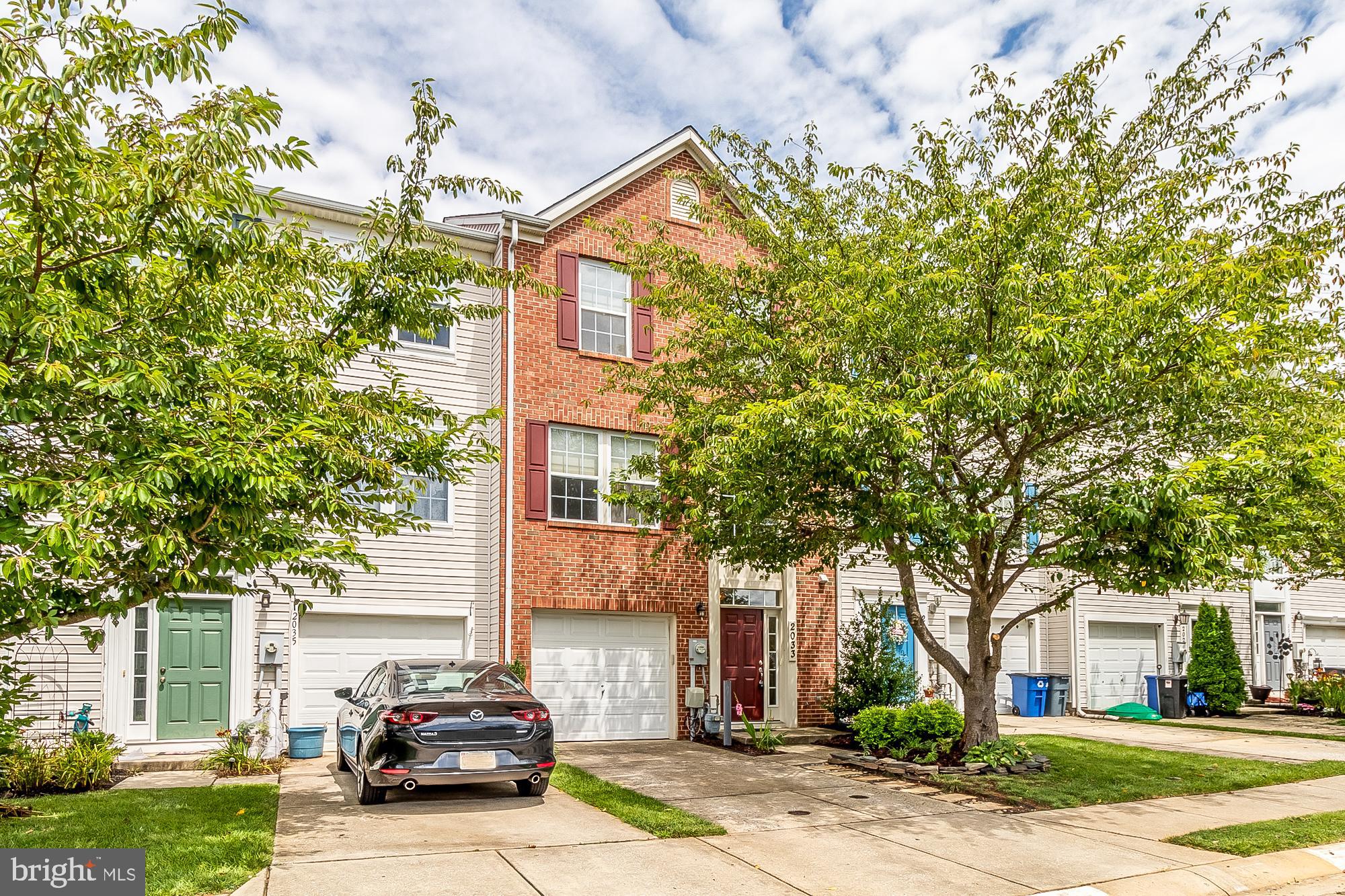 Stunning 3 bedroom, 2 full  and 2 half bath garage townhome in Spenceola Farms!  Three story bump out.  Entry level features a large family room with lots of natural light, recessed lighting, laundry area, half bath and garage. Second floor with gourmet open kitchen with white cabinets, granite counters, stainless steel appliances, pantry, kitchen island and hardwood floors. Dining area, sun room with gas fireplace, and plantation shutters. Large front living room with custom blinds and half bath.  Upper level with spacious primary bedroom with walk-in closet with barn door, skylight , en suite bath with double vanity, sunken tub, stand up shower and skylight. Two additional bedrooms (one with custom built-ins) and hall bath. All bedrooms include upgraded shades.  Deck off rear of the home with steps to back yard. Great lot that backs to open space. Roof has been replaced. This home is gorgeous and in pristine condition!