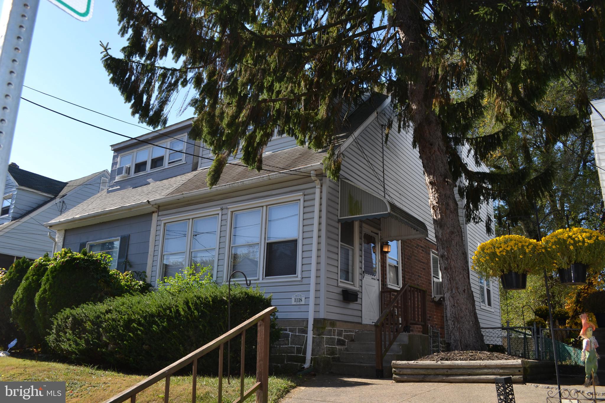 Well Maintained Three Bedroom Twin  with Charm and Character in Llannarch Hills and Upper Darby School District. First Floor features Enclosed Front Porch, Spacious Living Room with Corner Fireplace and Formal Dining Room with High Ceilings, Crown Molding and Hardwood Floors, Modern Kitchen with Gas Stove and Dishwasher and Outside Exit to Rear Deck. Second Floor has Large Main Bedroom with Ample Closet Space, Two Additional Bedrooms, Hallway Bathroom with Nice Refinished Bathroom. Lower Level has Many Possibilities for Storage with Laundry Area and Utility Area plus Outside Exit to Rear Yard. The Enclosed Front Porch has the Charm of the Older Homes and is ideal for your Plants, Relaxing, and Reading your Favorite Books. The Rear Cover Deck offers the Perfect Place for Barbecues, Entertaining and Family Gatherings. There is a Rear Alley and Driveway for Off Street Parking. Great Location near the Hillcrest Elementary School, Township Line Road and Route 1, Public Transportation, and Quarry Center with Giant, Lowes, Panera Bread, and Chipotle. This Fine Home has a Brand New UCI Gas Boiler Providing Very Efficient and Comfortable Heat. There is a One Year Home Warranty to the Buyer and Settlement. The Refrigerator and Washer and Dryer are included in AS IS condition. This Great Home is MOVE IN READY  ! Inspect and Make a Serious Offer !