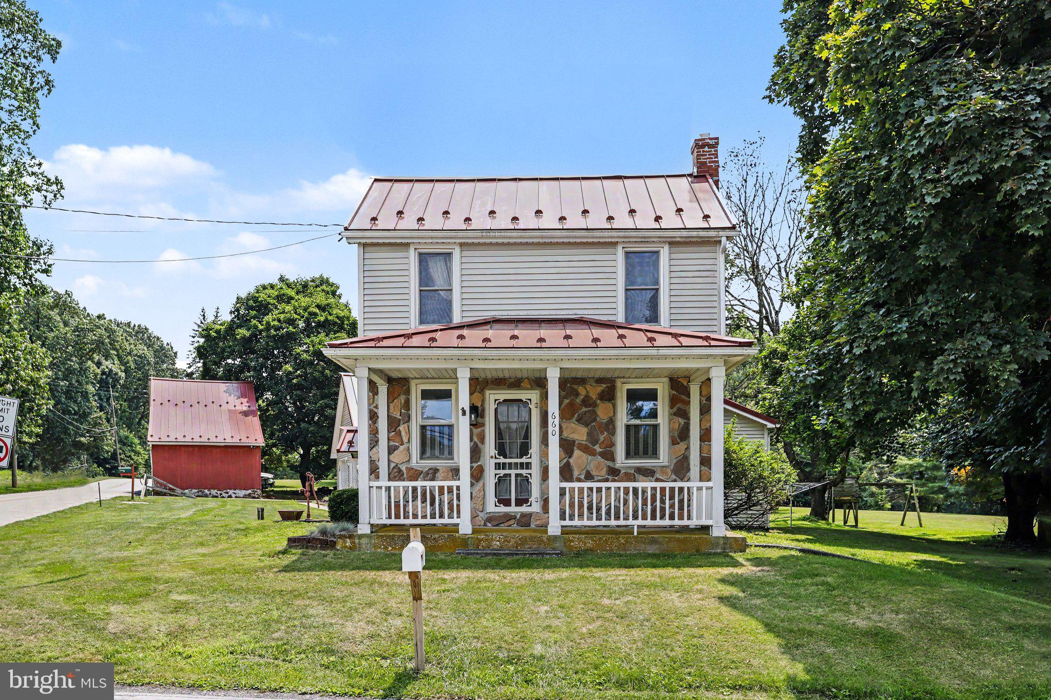 Welcome home to 660 Mumper Ln, Dillsburg, PA, a charming farmhouse offering 2,153 finished sq ft of comfortable living space spread across a level and partly wooded 8.73-acre lot. This private country retreat features 3 bedrooms situated on the upper level and 1.5 bathrooms, presenting a traditional floor plan complete with a defined dining area, a functional galley-style kitchen, main-floor laundry, and cozy hardwood flooring.  Outdoors, the property maximizes its expansive acreage with a spacious detached 2-car garage featuring a partially finished second story, for a hobby workshop or bonus room.  An additional barn that provides generous storage space as well.  Beyond the tranquil borders of your acreage, this property is ideally positioned just minutes from downtown Dillsburg and offers convenient highway access to major regional hubs like Mechanicsburg, Harrisburg, and York.  Daily errands are effortless with the nearby Dillsburg Shopping Center, while regional dining staples like Baker's Diner provide local flavor.  For recreation and outdoor enthusiasts, the area is rich with activities, being situated just west of the expansive State Game Lands Number 242 for hiking and wildlife viewing.  Winter sports and outdoor adventure are highly accessible at the nearby Roundtop Mountain Resort, located less than 15 minutes away, while local green spaces like Chestnut Park offer community areas and basketball courts.  This property balances serene, private country living with excellent proximity to municipal services, shopping, and year-round recreation.