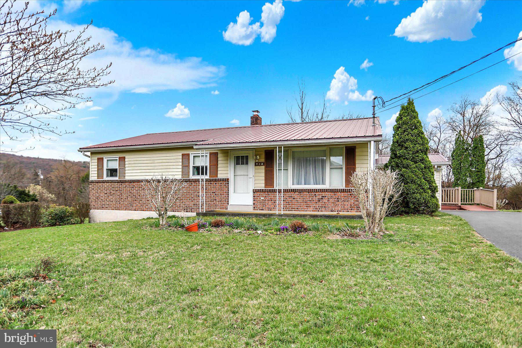 What a wonderful place to call home! This home has a view and the school is within walking distance. If you want to take a walk to town to have a bite to eat, go to the post office, or enjoy the nearby community park and swimming pool it is all so close! This home has central air and heat with wall propane heater that helps supplement. There is EBB in the sunroom. The detached shed will house your car and has a garage door opener along with the integral garage. The LR coat closet has the access panel for the attic. The bath room has a large walk in shower but no bath tub. Your view out the rear is woods and no houses! There is so much to love about this home do not miss your opportunity to schedule a showing and see for yourself!