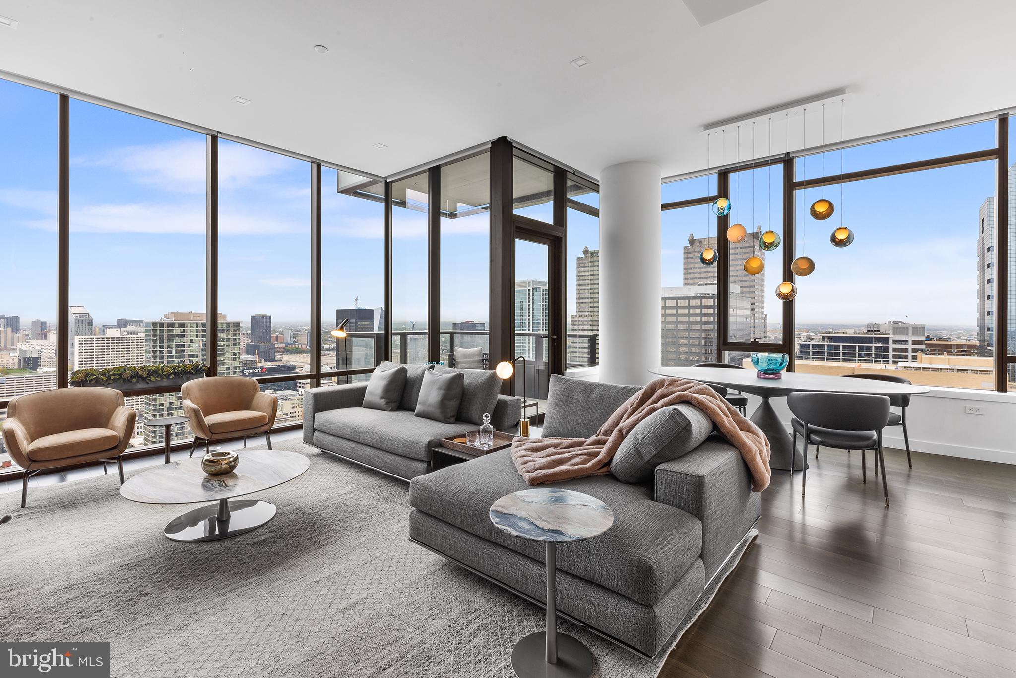 Introducing The Laurel, Philadelphia's newest luxury Condominium and the final residential opportunity on historic Rittenhouse Square. The striking glass tower soaring 48 stories is a masterpiece of contemporary architecture designed to inspire. The Laurel offers quarter floor Sky residences, half floor Estates and full-floor customizable Penthouses.  Come home to one of the most spectacular sunsets the city can offer through the floor to ceiling windows.  The corner balcony allows for a dynamic experience of views from north, west and south giving this home optimal light exposure.  The Euro-style kitchen showcases a stunning high gloss Polar White cabinetry.  Your chef will enjoy this state-of-the-art Sub-Zero and Wolf with an integrated refrigerator, gas cooktop, steam oven and full size convection oven. The kitchen island features White Statuary Quartz counters with waterfall edge, a large undermounted sink, Dornbracht faucet, Signature dishwasher and under-counter drawer microwave.  Gorgeous 6” plank dark  oak hardwood from Carlisle can be found throughout this home including the bedrooms.  Homeowners will enjoy a spacious owner’s suite with two large walk-in closets, stunning sunset views and your own private spa-like oasis with luxurious freestanding soaking tub atop Empyrean Ice White marble floors surrounded by floor to ceiling porcelain walls and complimented by an expansive shower with Fantini shower fixtures.  A comfortable size laundry room with full size Maytag washer and vented dryer make life easier.  Prewiring for future blinds and smart home technology complete this magnificent residence.
***One parking space is included in listed price, second parking space is available for additional $100,000***