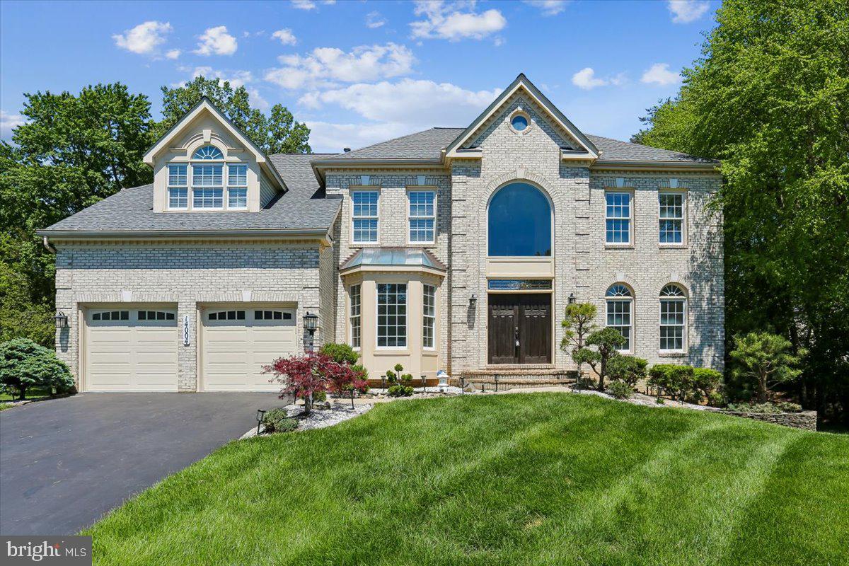 DON'T MISS THE 3D IMMERSIVE TOUR!
EXCEPTIONAL CUSTOM-BUILT HOME ON PREMIUM CUL-DE-SAC LOT

Welcome to 14004 Red Ash Way, a beautifully customized D.R. Horton Martha Washington III model with over 5,500 square feet of premium expanded footprint tucked away on a quiet cul-de-sac and backing to serene conservation views in highly coveted Willows of Potomac. All new paint, refinished floors, and more in this stunning 4-bedroom, 4.5-bath, 9 foot-ceiling home in the Wootton HS cluster, offering a rare blend of luxury, thoughtful design, and peaceful natural surroundings—frequented by deer and enhanced by a tranquil, Zen-inspired landscape with white pines and pebble accents.

INSIDE, you’ll find exquisite craftsmanship throughout all three levels, including extensive crown molding, detailed door frames, and base moldings—a truly unique and upscale feature. A dramatic two-story foyer opens to refinished hardwood flooring, bright formal living and dining spaces, a private home office/library, and a spacious family room that flows seamlessly into the gourmet kitchen with spacious center island, new quartz countertops (2026) and brand-new stainless steel appliances (2026). The family room is centered around the wood-burning fireplace ideal for game nights in this cozy gathering space, with premium two-story sunroom with skylight addition, a rarely available upgrade to this model! This three-level extension to the home footprint also results in an expanded basement space and bedroom upstairs.  Laundry room with new washer and dryer, updated powder room with new vanity, and two car garage complete this floor. Outside, you’ll find a spacious deck overlooking a nature conservancy, redone stone patio and mature plantings throughout. 

UPSTAIRS,  enjoy HARDWOOD FLOORING throughout, and a luxurious owner’s suite with VAULTED CEILINGS, a spacious sitting area, laundry chute, walk in closet.  Owner’s ensuite bathroom is bright and airy with new his and hers updated vanities, faucets, skylights, linen closet, soaking jacuzzi bathtub and walk in shower. Bedrooms two and three (with expanded spacious floor plan due to builder's upgrade) share Jack and Jill bathroom with dual vanities and bathtub with tile walls, and Bedroom Four with ensuite bathroom. 

THE WALK-UP LIGHT-FILLED LOWER LEVEL offers incredible versatility with multiple rooms, a spacious recreation area, a full bathroom with walk-in shower, new LVP flooring, a wet bar for entertaining in this unique and expansive space and extra refrigerator. This incredible home offers a multitude of flexible family gathering spaces and upgraded layout you won’t find in many other homes of this model, all in amenity-rich Willows of Potomac with walking trails, community pool and club house, playgrounds and tennis courts, close to the shops at Travilah and Rockville, Kentlands, Fallsgrove and Rio, Lakelands Country Club, and minutes to Potomac, and 270/495. 
MAJOR UPDATES INCLUDE:
Roof (2016)
Main HVAC (April 2026) & Attic HVAC (2020)
Hot Water Heater (2026)
New washer/dryer (2026)
Brand new Quartz Countertops (2026), Gas cooktop (2022), Refrigerator  & Dishwasher (2026)
Refinished hardwood floors (main level), New hardwood floors (upstairs)
Eight new combination carbon monoxide and smoke detectors throughout
New carpet on stairs & LVP flooring in basement,
Landscaping irrigation control panel replaced 2025
Exterior lights 2024

ADDITIONAL HIGHLIGHTS INCLUDE: irrigation system, Gutter Helmet, ADT security system, laundry chute, sump pump, and prepaid lawn care services for 2026.

WITH EXCELLENT FENG -SHUI ELEMENTS  and a layout designed for both ultra comfort and entertaining, this home is truly special.   Stay tuned—this one won’t last!    ****OFFERS ARE DUE MONDAY 5/11, 12:00-1:00****