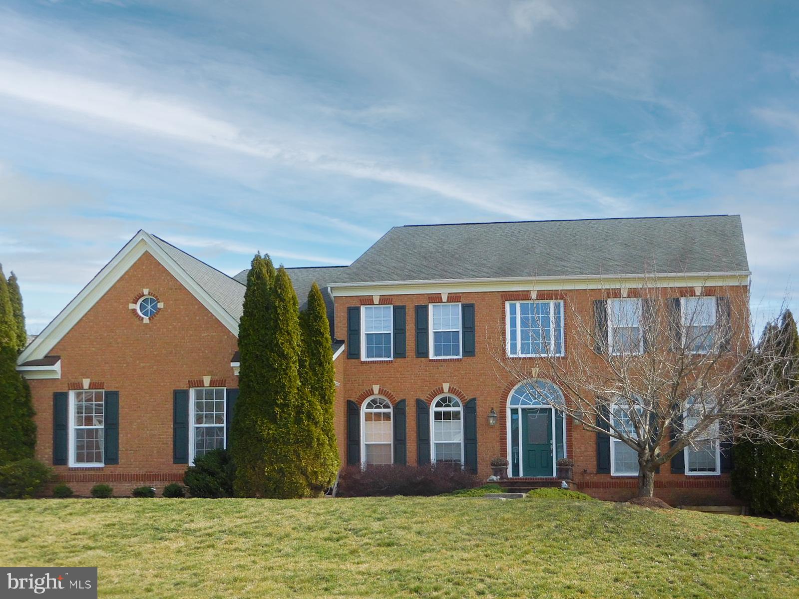 Classic brick colonial in sought-after MEADOW BRANCH! This beautifully maintained home has 5 bedrooms, 4 baths and 1 half bath, and, with a fully finished basement, offers just over 5,000 square feet of living space. The large corner lot, at just over one half acre, provides extra space for a young family, and plenty of gardening opportunities. A spacious deck , easily accessible from the kitchen, provides a comfortable spot for outdoor living.
The freshly painted interior of the home was designed for easy flow without being totally open. The entrance hall bisects the formal living room and dining room, and leads back to a family room/kitchen with breakfast area, and gas fireplace. A bedroom, full bath,and  laundry complete the ground floor, all rooms finished with hardwood flooring. 
Upstairs is the spacious primary suite with two large walk-in closets and a full bathroom with soaking tub. Three other good-sized bedrooms and two more baths complete the upstairs living space. Each bedroom has wall-to-wall carpeting.
The basement, complete with kitchenette and half bath, was totally finished in 2018, providing space for a work-out room, man cave or playroom. Plenty of light comes through the exterior door and windows on the back of the house. Xfinity internet.
The convenience of being in town and close to shopping and historic downtown Winchester makes this a very special home!