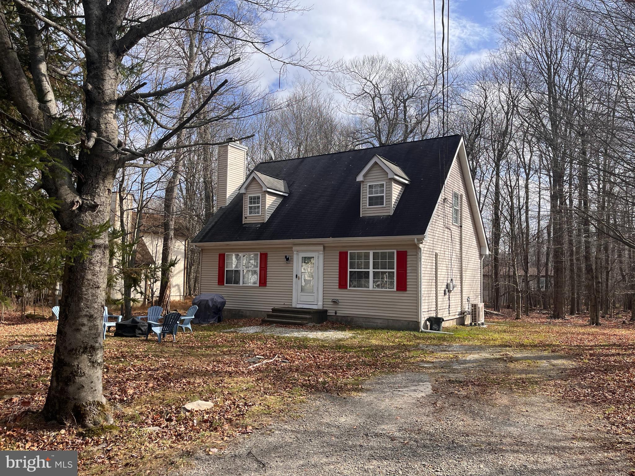 Welcome home to this fabulously renovated, vacation location!   This lovely, 3 bedroom, 1.5 bath home is nestled in A Pocono Country Place, surrounded by wildlife and lots of amenities. As you enter 1154 Jewel Terrace you are welcomed by a cozy, fireside living room, with maintenance free flooring.  The first-floor open concept is delightful.  A large dining area/kitchen features stainless steel appliances and ample counter space and cabinetry.  The first floor also features a bedroom, ½ bath and laundry room.  From the dining area, you can enter the three-season porch, overlooking the rear yard.   The second floor has two large bedrooms and a full bath.  The home was renovated in 2023, new gutters, new front door, all new trim, new carpeting – steps and hall, painted throughout, new sump pump, and the mini splits and the hot water heater was just installed in 2024.  The community has three sections all with a pool and clubhouse (which all owners can use).  Other amenities include dog parks, tennis courts, basketball courts, there are community bonfires, dinners, bingo, casino trips, aerobics, yoga, swim lessons, trivia nights, paddleboards and boats for rent.  There are two lakes, Lake Dresser and Lake Carobeth!    Both available for paddleboating, canoeing, electric motorboating, fishing and swimming.  Come see for yourself, you will love 1154 Jewel Terrace and A Pocono Country Place.