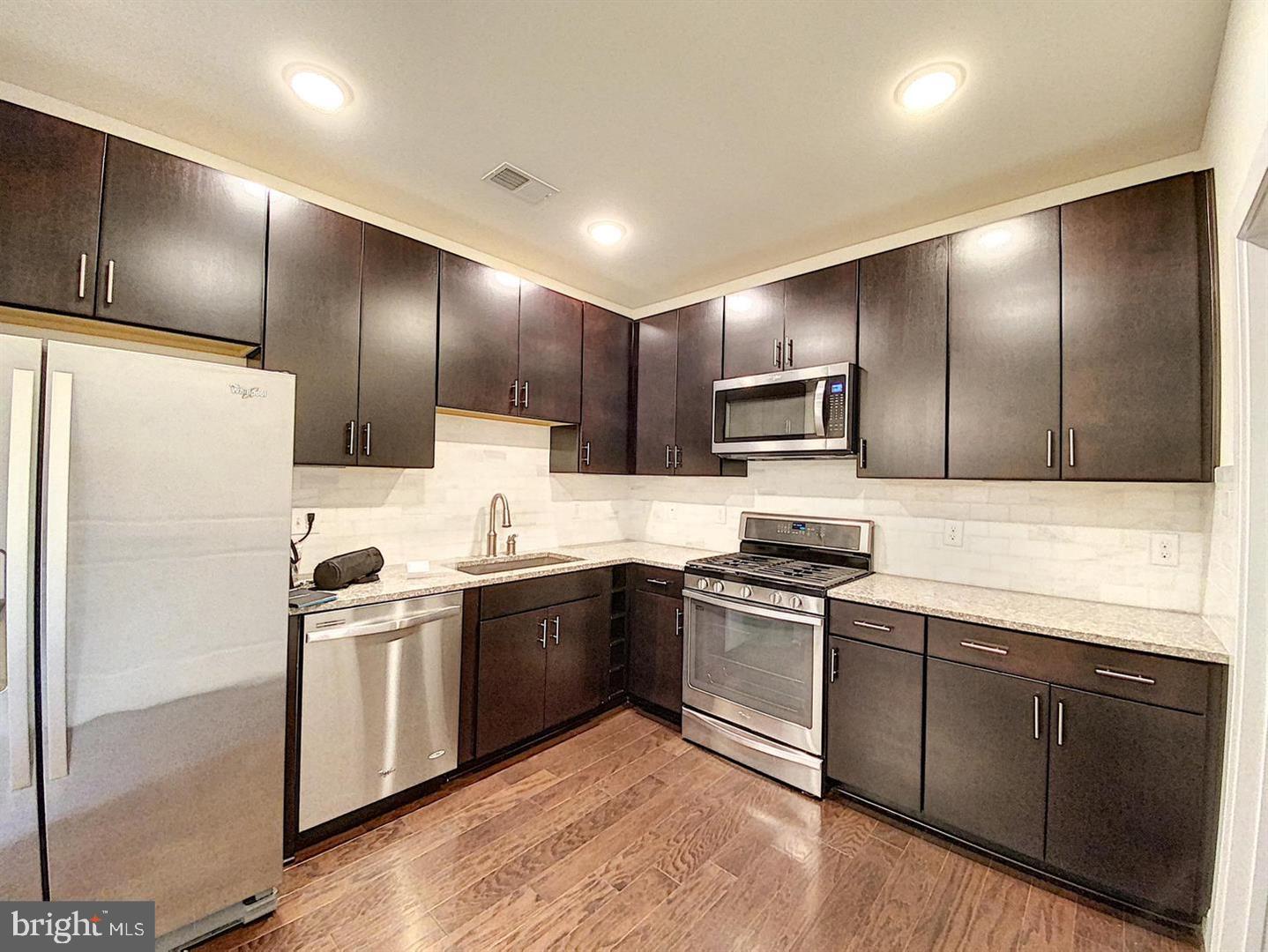 Beautiful 2-Bed, 2-Bath Condo in Prime Vienna Location!
Step into this stunning, light-filled condo just moments from the Vienna/Fairfax Metro Station! Boasting an open floor plan with spacious living and dining areas, this home is perfect for both relaxing and entertaining. The gourmet kitchen impresses with granite countertops, a convenient breakfast bar, rich maple cabinetry, stainless steel appliances, and elegant hardwood flooring.

The primary suite offers a walk-in closet and a luxurious en-suite bath, while the private balcony provides a peaceful retreat with lovely neighborhood views. This secure, fob-access building includes elevator access and comes with two assigned underground garage parking spaces plus additional outdoor guest parking.

Residents enjoy access to the Providence Community Center, featuring a gym, fitness center, game room, and more.

With quick access to Routes 29, I-495, and I-66, this is a commuter’s dream!