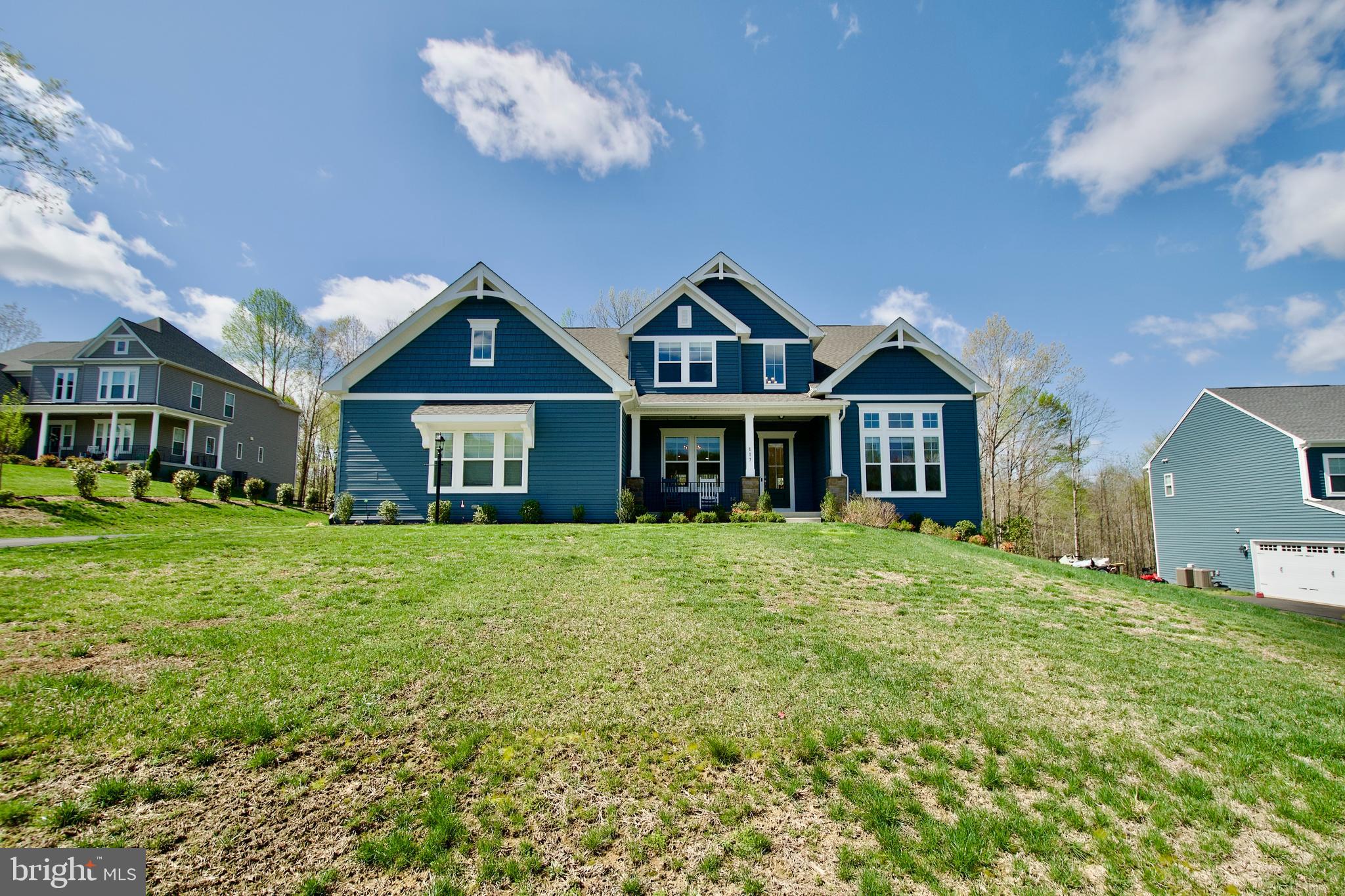 The Peacefield model is a classic home with modern luxuries.  Step inside and be greeted by an open floor plan that effortlessly combines contemporary design with  comfort. The gourmet kitchen, stainless steel appliances and a spacious island, is perfect for entertaining, cozy up by the fireplace in the living room. The main level primary bedroom offers tranquil sanctuary with a spa like ensuite bathroom and a walk in closet. A acre and half of land provide ample space for outdoor activities and relaxation,  the serene views of nature from your backyard.  Many upgrade features are window treatments, fans,  presently there is an electric stove top-but  equipped with gas line is available for a gas stove top, LL has rough ins for full bath and wet bar. A few miles from I-95, easy access to the HOV lanes for an easy commute, and  VRE station.