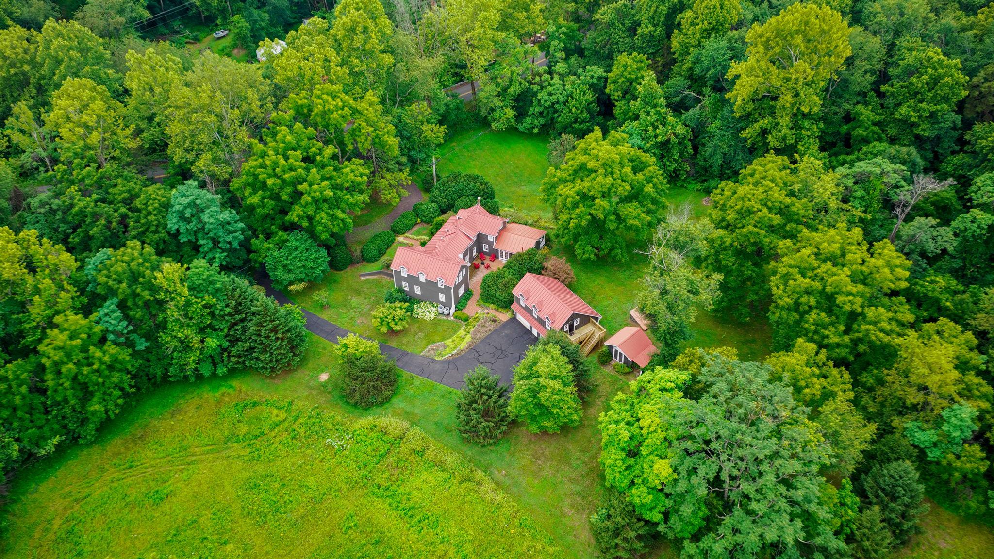 MASSIVE PRICE REDUCTION.  Seller had a work relocation. Homes of this caliber, size, and setting do not come available with no HOA or Covenants.  This exquisite residence offers nearly 4,000 square feet of inspired living where timeless charm meets modern comfort. Originally built in 1927 and thoughtfully expanded in 2004, the home has been carefully refreshed in recent years with beautiful updates that elevate both style and livability. The current owner added refined details throughout, creating an impressive estate feel ideal for a weekend retreat or full-time residence. The apartment with the upscale design and layout is ideal for a long-term rental or additional family space.

The main level makes a striking first impression with a gracious foyer, spacious family room, and a versatile den perfect for a home office or guest space. The expansive dining room with its cozy wood stove offers flexibility for entertaining or everyday living. A bright kitchen and breakfast nook provide generous gathering space with convenient access to the patio and back porch.

Upstairs, the owner’s suite is joined by two additional bedrooms and a large flexible loft ideal for a play area, office, or creative studio. The lower level expands the living options with a generous bedroom and full bath, perfect for a game room, media space, or private guest suite.

Outdoor living truly sets this property apart. A wide front porch, private side porch, and brick patio are surrounded by mature evergreens, scenic trails, and lush landscaping that elevate the sense of privacy and escape. The oversized garage offers ample room for vehicles and a workshop, while the upscale loft apartment above includes a living area, kitchenette, full bath, bedroom, and private porch, making it ideal for guests or additional flexibility.

Ideally located between Little Washington, Warrenton, and Culpeper, and just minutes from local wineries and Shenandoah National Park, this property combines location, lifestyle, and value. Recent updates are listed in the document section. Exceptional value, extensive improvements, and a significant price adjustment make this a must-see property that should not be missed.

Formal Appraisal Value, $900,000.