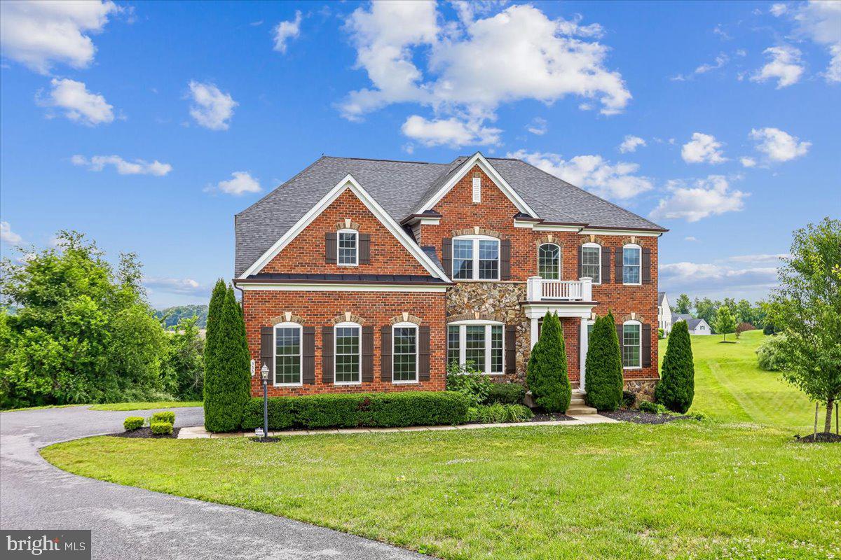 Rare opportunity to own a truly exceptional home in sought-after Pooledale Farm. Offering nearly 6,000 square feet of beautifully updated living space and breathtaking panoramic farm views, this custom residence seamlessly blends luxury, comfort, and functionality.

Thoughtfully redesigned by Worthington Home, the property showcases high-end finishes and sophisticated designer touches throughout. At the heart of the home is a stunning gourmet kitchen featuring a white Silk Quartzite waterfall island, full-height Quartzite backsplash, handcrafted graphite soapstone range hood, contemporary lighting, a new Wolf cooktop, and double wall ovens. Designed to impress, this space is equally suited for everyday living and entertaining on a grand scale.

Tons of luxury upgrades, including custom wood pantry shelving, heated bathroom floors, renovated bathrooms, enhanced theater room audio, and a beautifully finished lower level. The expansive basement offers versatile living space complete with a recreation area, guest suite, option, full bath, and private theater.

Step outside to a sprawling backyard retreat featuring a massive deck off the family room—perfect for hosting gatherings, enjoying sunsets, or simply taking in the serene countryside views.

Additional features include a whole-home sprinkler system, remote-controlled thermostats, and an intercom system throughout. Offering the tranquility of country living with the ideal layout for entertaining, this one-of-a-kind property delivers an unparalleled lifestyle in one of the area's most desirable communities.