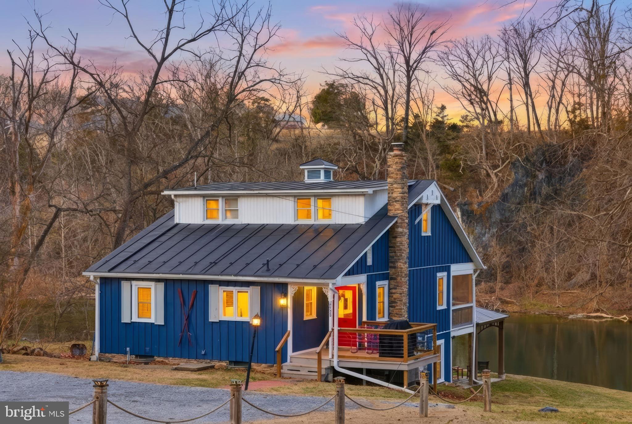 Turn-key 5BR/3BA Shenandoah Riverfront vacation property located on a stunning wide stretch of the river—perfect for fishing, kayaking, andrelaxing. Enjoy beautiful river views from this charming cottage. Main level features living and dining areas, charming built-ins, kitchen with wood countertops,stainless steel appliances, and a full bath with tiled shower. Spacious screened-in porch overlooks the river. Upstairs offers two bedrooms with vaulted ceilings, built-in dresser, and a full bath with clawfoot tub. Lower level includes a second living area with walkout patio, three bedrooms, and full bath. Outdoor amenities includehot tub, gazebo, kids’ playground, and large storage shed for mower and kayaks. Could be a great primary residence, second home, or investment, with excellentSTR income history—over $100K gross in each of the past two years.