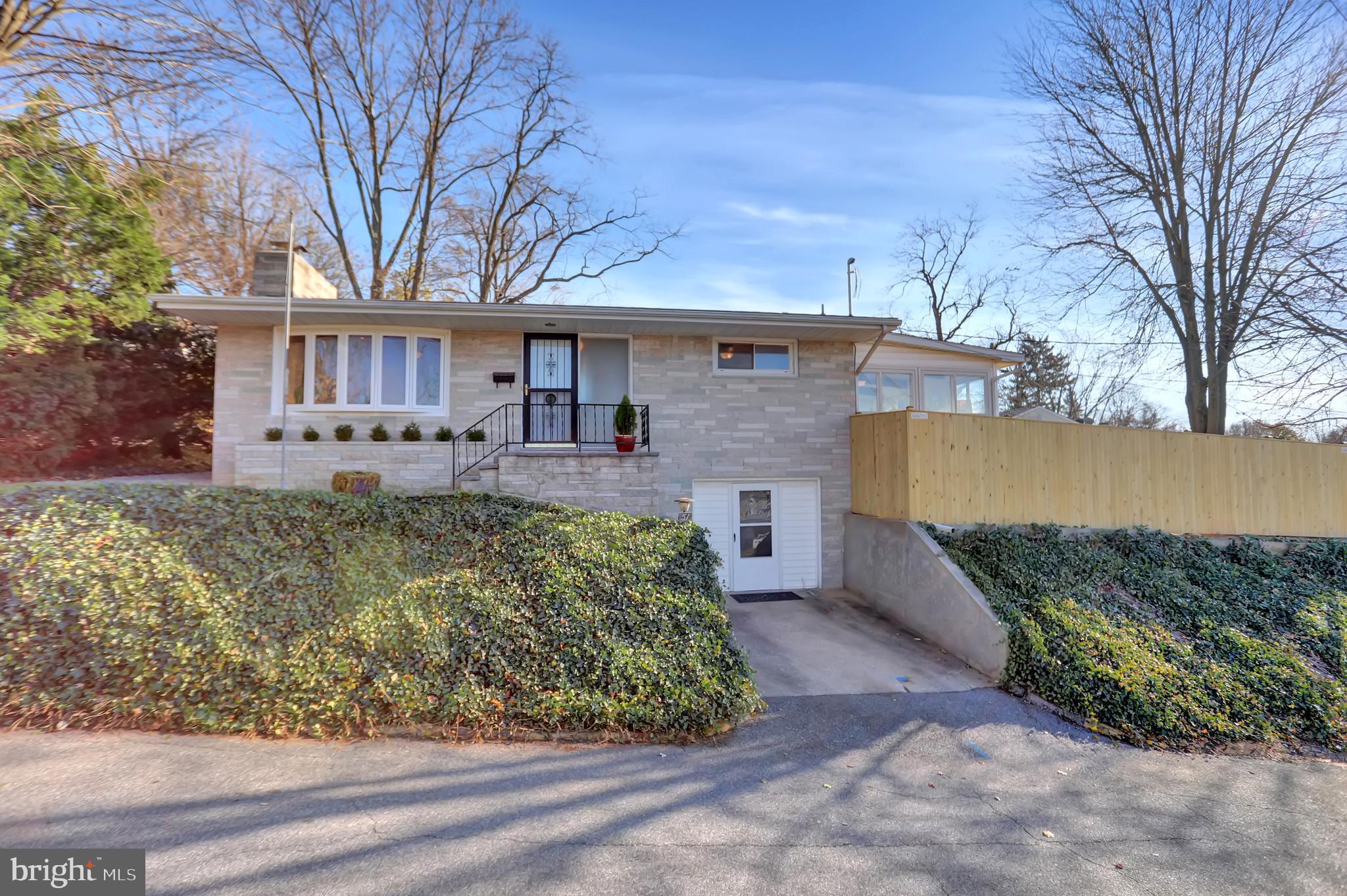 Seller offering a $5,000.00 credit to Buyer for either a kitchen remodel or 3rd bedroom installation in lower level. PERFECT OPPORTUNITY TO ENJOY IN-TOWN LIVING ON A QUIET STREET.  Walk to all the events, restaurants, library and shoppes throughout Historic Westminster, MD.  The owners have taken great care to complete many major renovations and upgrades to several areas of the home. A top quality new main bathroom with marble tile floors, marble top vanity, custom stand alone tub and new glass enclosed walk in shower. Main level walls are plaster and have been reconditioned and professionally sealed and painted. Stunning hardwood floors professionally finished and new blue slate tile floors installed in the foyer, kitchen and 4 seasons sunroom. On the exterior major grading and installation of a diverter drain in rear and side yard, installation of new foundation window wells and ground repair in July 2022.  A reinstalled t retaining wall along the alley to support a recently installed custom wood privacy fence surrounding a courtyard garden which will be in full bloom come spring.  Special financing program is available for qualified buyers at 5.25% interest rate.  The property will be ready for immediate occupancy.  The owners have completed many necessary projects, however due to their recent relocation, the lower level was in the process of being renovated and not completed.  The original custom built raised rancher design included a 3rd bed room in lower level.  However, original owners eventually decided to remove a wall to enlarge the recreation/family room.  To  re-create a 3rd bedroom now requires a review from the country government to verify current codes.  All systems and utilities have been upgraded or replaced by licensed contractors. Converting  the previous 1-car integral garage into habitable accommodation for a 3rd bedroom is one of the easiest ways to increase your living space.