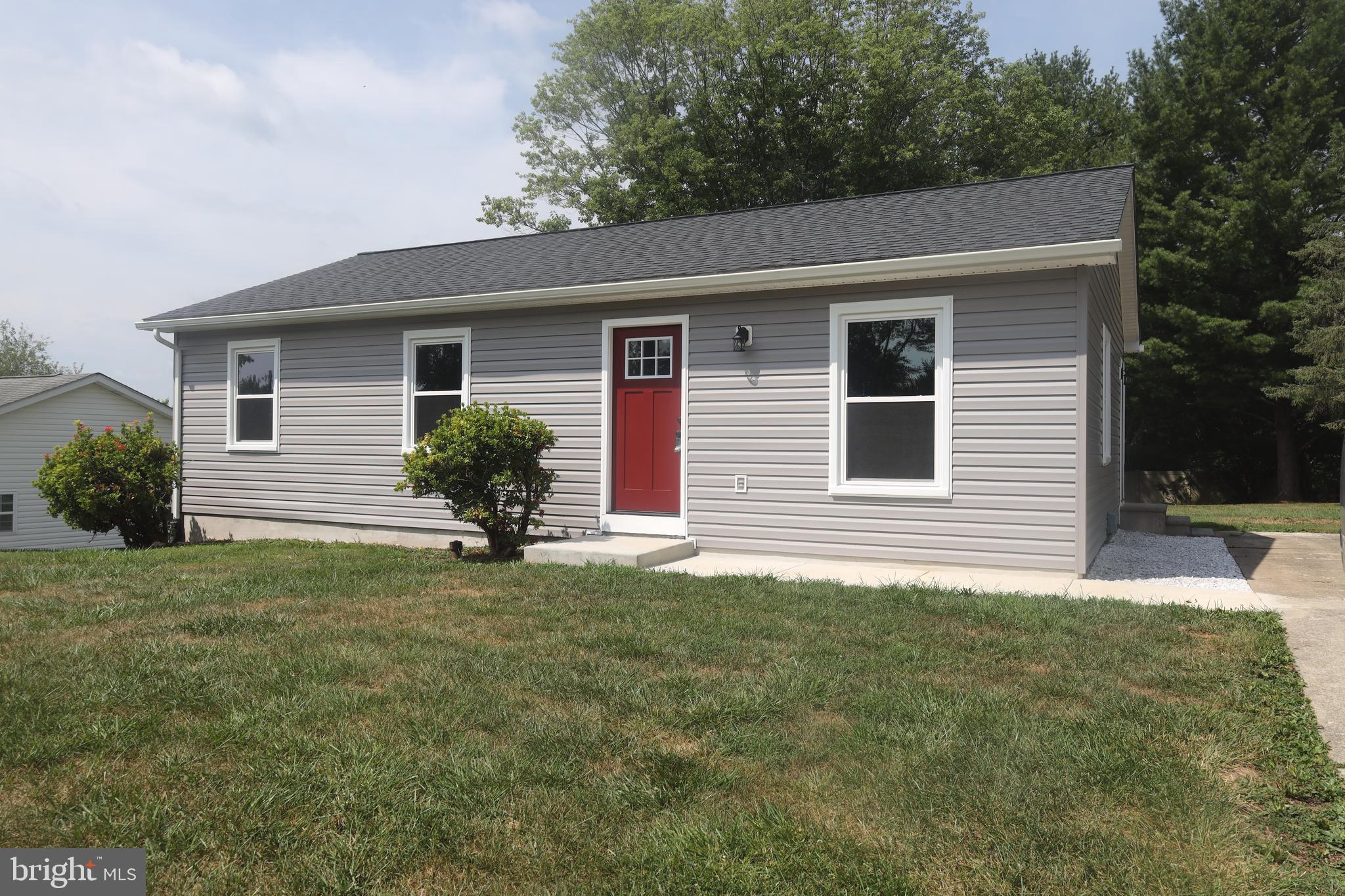 This 3/4 Bedroom home has 2  Full Baths and sits in a country setting.  It has been completely remodeled inside and out.    New siding, new roof, new windows and landscaping on the outside.  The inside has been freshly painted, all new flooring, kitchen has new stainless steel appliances and new cabinets.    The eat-in kitchen also has new counter tops, beautiful backsplash and top of the line kitchen sink.   The basement family room has built in book shelves and a full bath off of it.  The office/ 4th bedroom has built in book shelves as well.  There is plenty of storage and the laundry room in the basement too.  Large rear yard! Convenient to shopping, schools, travel and historic sites.