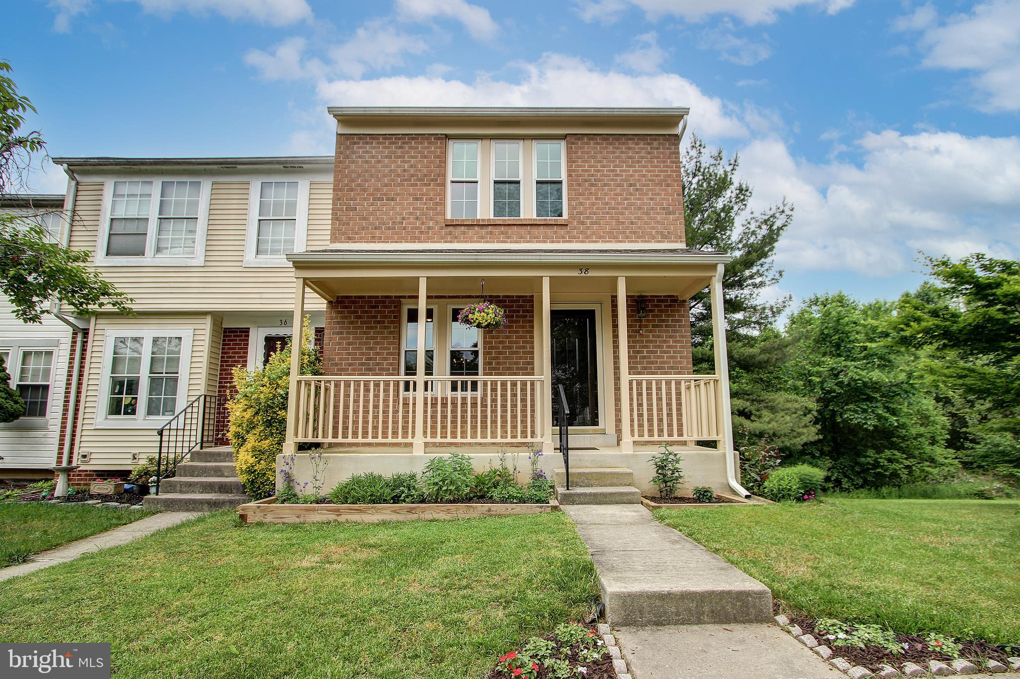 This stunning end-unit townhome is located in one of the most desirable communities in Germantown. The home backs to conservation area and features stately brick front exterior with a expansive front porch. The main level features custom oak flooring and cherry wood trim. The eat-in kitchen is upgraded with quartz counters and a new refrigerator, stove, and lighting. The formal dining room is spacious with plenty of room for entertaining. The living room is bright with large bay window and upgraded skylights. You have direct access to your back deck from the living room with peaceful views of the trees and conservation area. The upper level master bedroom includes double closets and access to the renovated full bath. The lower level is finished with a huge rec space, laundry room, and storage. There is also a cozy fireplace and walk-out to your backyard. Located within minutes to shopping, restaurants, and public transit. Peaceful community with swimming pool, common grounds, and walking paths. Don't forget to view the virtual tour!