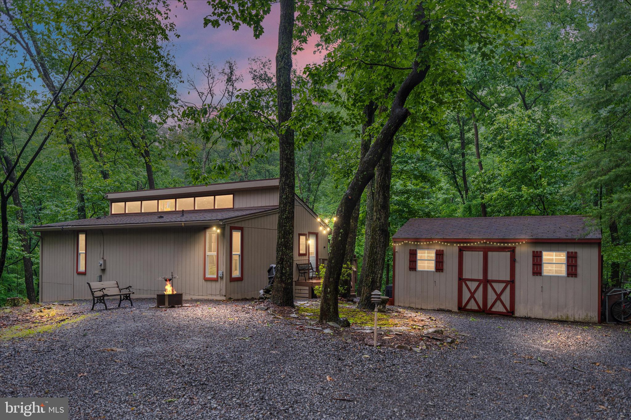 Welcome to 211 Cayuga Trail, a cozy retreat tucked away on nearly a full acre in The Woods. Surrounded by mature trees and natural beauty, this 2-bedroom, 2-bath home offers the perfect balance of privacy, comfort, and peaceful living. The spacious setting provides plenty of room to enjoy the outdoors, whether you’re sipping your morning coffee while taking in the quiet surroundings, hosting friends and family, or simply unwinding after a long day.
Inside, you’ll find a warm and inviting layout designed for both everyday living and relaxation. The home offers comfortable living spaces filled with natural light, creating an atmosphere that feels cozy and welcoming throughout. 
Located in the scenic mountain setting of The Woods, 211 Cayuga Trail offers a rare opportunity to enjoy the beauty of nature while still being conveniently located to local shopping, dining, and outdoor recreation. If you’ve been searching for a peaceful place to call home with space to spread out and enjoy the surroundings, this property is one you won’t want to miss.