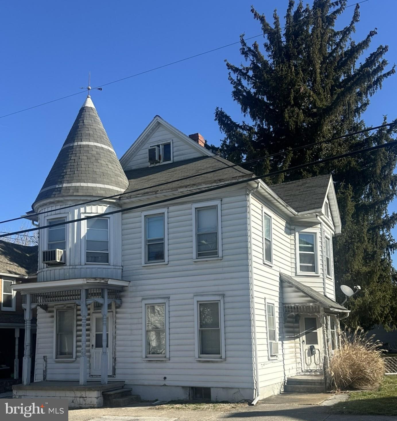 This 4-bedroom, 2 bath home has loads of character including beautiful wood moldings and an oak floor in the living room.  The entrance foyer highlights an open stairway with an elaborate newel post and turned spindles leading to the 2nd level.  The large dining room has a solid maple floor and pocket doors to the living room.  The home is heated by a Burnham natural gas boiler supplying hot water radiator heat.  There is a bathroom on each level, and all the 2nd level bedrooms have closets.  There is also a 11’ x 10’6” covered rear brick patio, fenced in yard leading to a 34’W x 56’L 2 story barn with an attached 14’6” x 56’ carport with blacktop for at least 3 cars.  The interior with a little bit of work has incredible potential to be beautiful.  HISTORY: In 1894 a cigar factory from White Hall was moved here.  Later the cigar factory moved to M Street in Littlestown.  This property then became the Henry A Spalding property and a large 2 story barn used as a Livery stable was built in the rear.  This was a thriving horse-trading business in the early 1900’s, one of the employees Charles McCaffrey worked for Henry Spalding and later acquired the property into the McCaffrey family.  This information is in the Littlestown Bicentennial Book Vol. I on page 144.  There is an old cupboard door in the office of the barn with the name H.A. Spalding stenciled on the inside.  Included with the property is a refrigerator, natural gas range/oven and Red Cedar wardrobe on 2nd floor stays with the house.