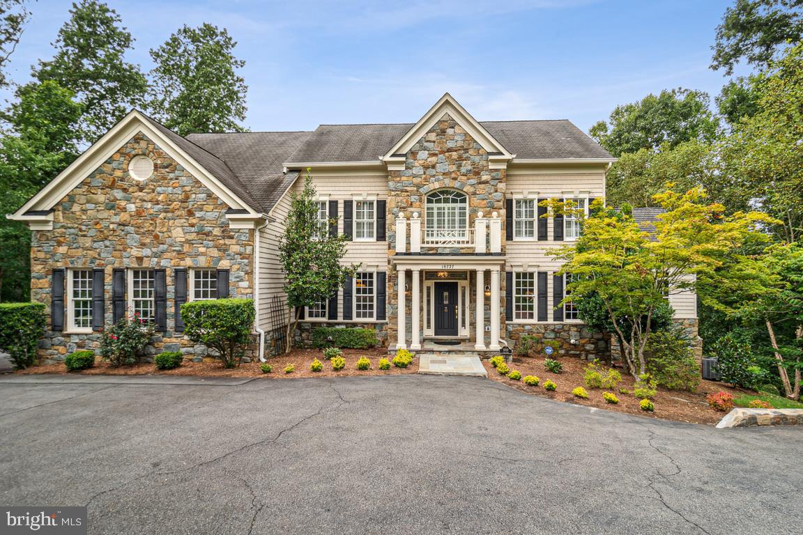 Welcome to this stunning estate home nestled in a serene setting with captivating wooded views in the heart of Oakton. This exquisite property offers a harmonious blend of nature and modern living. As you step inside, you'll be greeted by a flowing staircase and natural light filtering through large windows, showcasing the lush views that surround the home. The beautiful custom home offers 5 Bedrooms with  6000+ sqft of living space. The floor plan seamlessly integrates the living, dining, and kitchen areas, creating a spacious and inviting atmosphere. Enjoy the grand family room with 2-story ceiling and carefully selected finishes in a recently renovated kitchen, add an elegant touch to the interior, while maintaining a warm and welcoming ambiance.  This home offers a full screen theater room, a private Au Pair suite, and ample space for a home gym.

The outdoor space is equally enchanting, with 2 generously sized patios overlooking the wooded landscape and a meandering stream. It's the perfect spot to unwind, entertain guests, or simply enjoy the beauty of nature in your own backyard.

The Majestic 30 cherry blossom tree lined driveway leads to the front of the house which has enough space for 19 cars.

Direct walking access to Difficult Run Trail & Gerry Connolly Cross Country Trail, minutes to Oakton Shopping Center and Rt. 66 access.