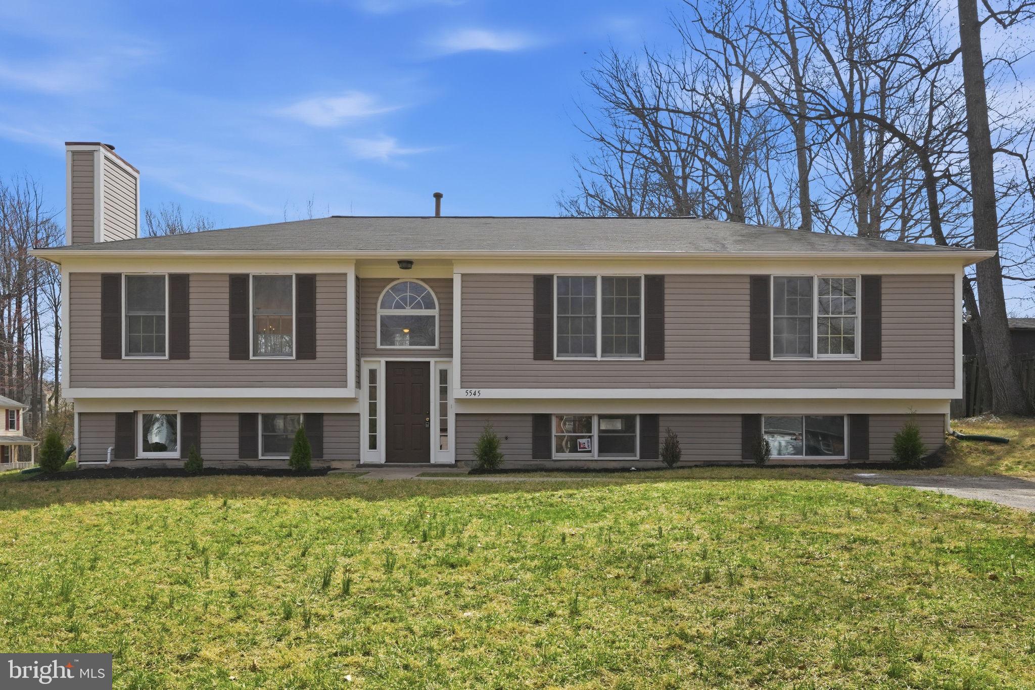 Welcome to 5545 Spangler Lane, a fully remodeled 5-bedroom, 3-full-bath single-family home tucked away on a quiet cul-de-sac in Dale City. With 2,812 finished square feet, a flexible split-level layout.
The main level features bright open living areas, updated LVP flooring, a refreshed kitchen with white cabinetry, stainless steel appliances, gas cooking, and a large island that anchors the heart of the home. The dining area opens directly to the rear deck, creating an easy flow for everyday living, grilling, and entertaining. The bathrooms have been tastefully updated with clean modern finishes, including a double vanity and oversized shower/tub surround in the primary-style bath.
Major improvements include a brand-new HVAC system, a newer roof, all-new appliances, updated flooring, fresh paint, modern lighting, and refreshed bathrooms. The lower level provides additional finished living space, bedrooms, full bath access, and walk-out functionality — ideal for guests, office space, multigenerational living, or a private retreat. Move-in ready, updated, and located on a quiet street with no HOA, this home is ready for its next owner.