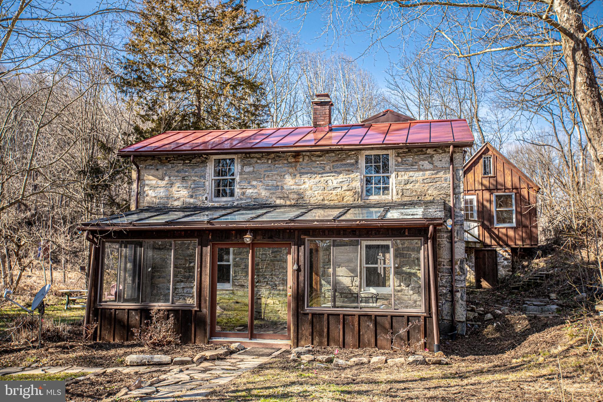 THIS PROPERTY CONSIST OF 2 DWELLINGS A COTTAGE IN THE VALLEY AND ADDITONAL  HOUSE ON  FALLS ROAD  WITH GUEST OR OFFICE QUARTERS AND WORKSHOP IN BASEMENT SITUATED ON  6.3617 ACRES WITH A STREAM ,
Escape to a world of charm and character with our one-of-a-kind property nestled in the heart of nature. This unique estate is a perfect blend of history and modern comfort, offering you a lifestyle like no other.

🌳 Main Residence: Step into a two-story old-world masterpiece, where vintage meets contemporary. Characterized by its timeless architecture, this home boasts spacious living areas, cozy bedroom, and picturesque views from every window. Main house has one bedroom

🏡 Office Studio  & Workshop: Discover the magic of space  and workshop, providing you the flexibility to turn your dreams into reality. Whether it's hosting friends and family or indulging in your favorite hobbies, this additional structure adds endless possibilities to your retreat.

🌉 Wooden Bridge: Connect with nature as you cross the enchanting wooden bridge over a meandering stream. This charming pathway sets the tone for tranquility, inviting you to leave the hustle and bustle of everyday life behind.

 Surrounded by  greenery and vibrant flora, the property offers a serene escape creating an oasis that soothes the soul.

 Wake up and unwind with  your new haven will make every day feel like a retreat.

🛠️ Workshop & Studio: For the creative minds, a spacious workshop awaits your artistic endeavors. Let your imagination run wild in a space designed to inspire and nurture your passions.

🍽️ Outdoor Entertaining: Host gatherings under the stars on expansive outdoor areas  or by the stream, with your firepit creating memories that will last a lifetime.

🚗 Convenient Access: While surrounded by nature, you're still conveniently connected to modern amenities. Shopping, dining, and entertainment options are just a miles away

This property isn't just a home; it's a lifestyle. Embrace the magic of a residence that seamlessly blends history, comfort, and nature. Your dream home awaits!   Sold as is