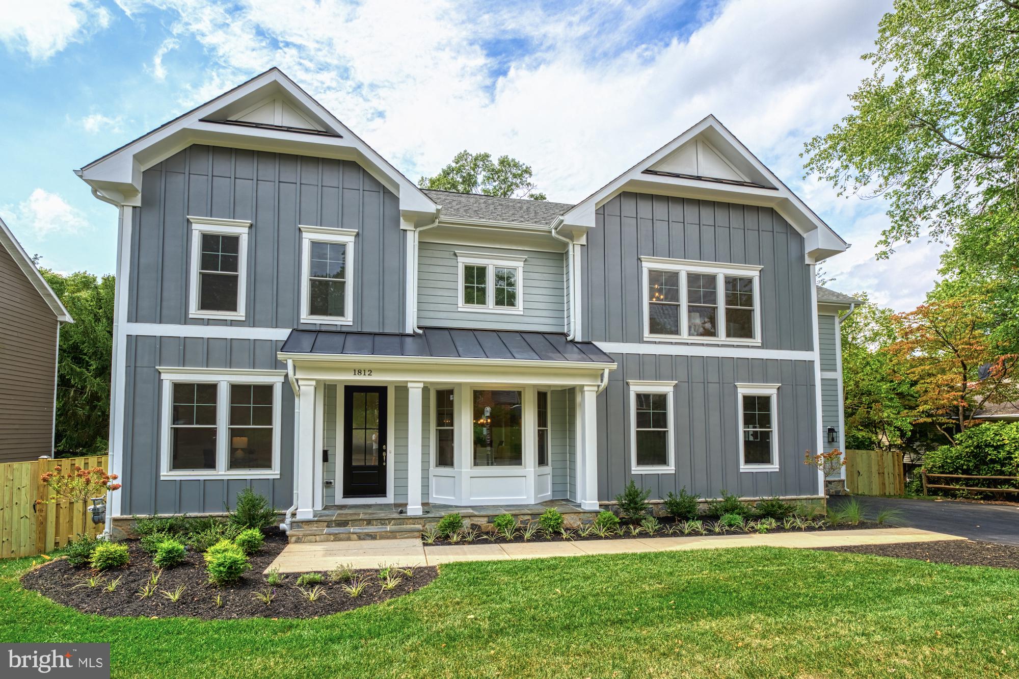 The "Woodford II" by Sekas Homes is a newly built, farmhouse-inspired single-family home located on a prime, treed, and fenced 0.24-acre lot in the heart of McLean. Spanning over 5,300 square feet across four levels, this home features 6 bedrooms, 6.5 bathrooms, and an impressive array of amenities, including a chef-inspired kitchen, a family room with a fireplace, a study, and 9' ceilings on three levels. The owner’s suite offers a luxurious retreat with two walk-in closets and a spa-like bathroom, while the finished basement includes a recreation room, exercise room, game room, fifth bedroom, and full bath. The loft level adds another bedroom and bath. The exterior of the home is just as stunning, with a fenced yard, Trex deck, and a screened-in porch, providing ideal spaces for relaxation and outdoor entertaining. Ideally located just minutes from McLean High, Lewinsville Park, Chain Bridge Rd, and downtown McLean shopping, this home offers the perfect blend of comfort, convenience, and luxury, all within the sought-after Kent Gardens/Longfellow/McLean pyramid. Ready for immediate delivery!
