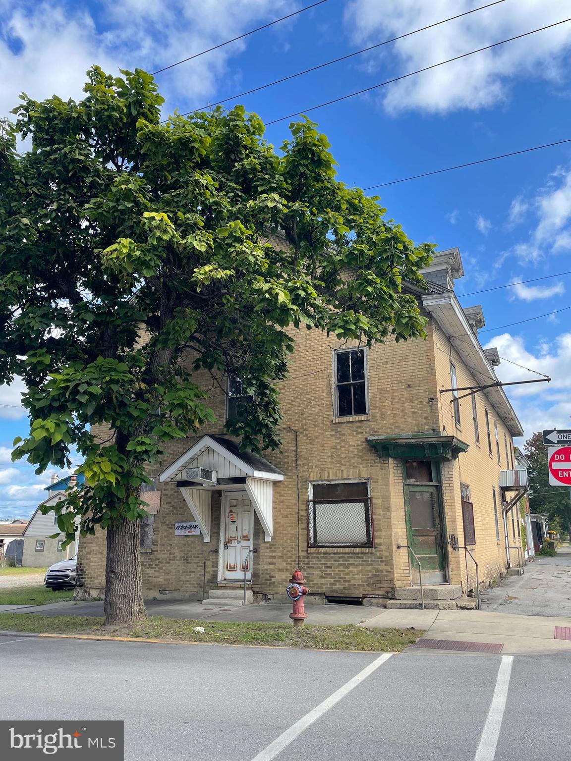 Calling all investors! This multi use commercial building is ready for your creative touch! Build out the lower level to be a restaurant, laundromat or more! Upstairs are endless rooms to be able to utilize as apartments. Located on a corner of downtown Philipsburg on .11 acres.  A small driveway is to the left of the building.  Plans for current renovations are available.