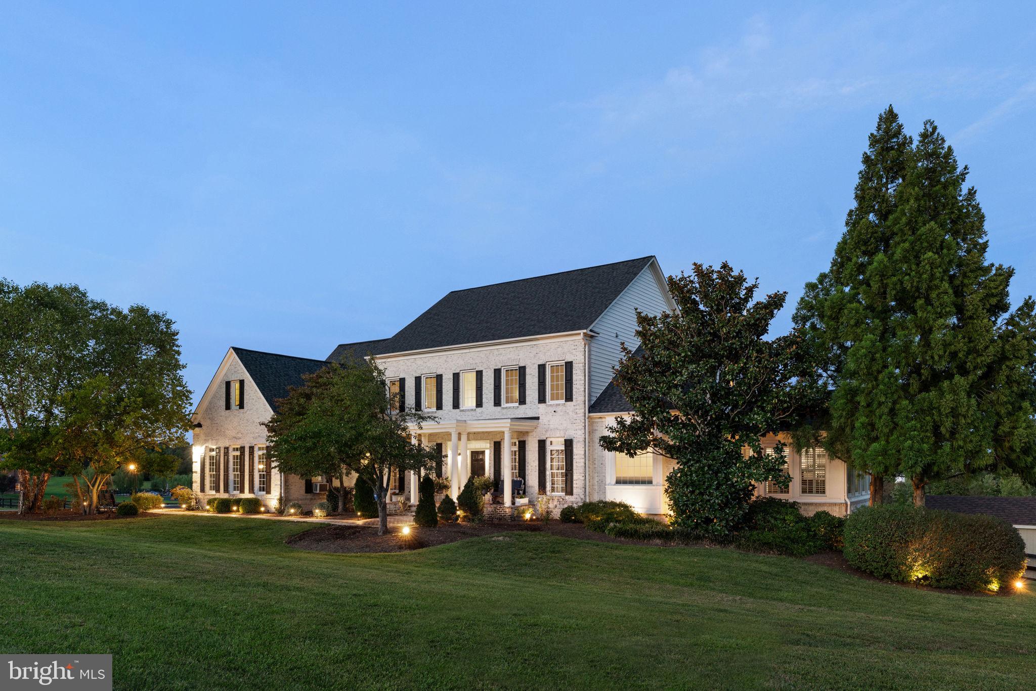 Discover Your Dream Home with Breathtaking Views! Farmette & equestrian potential! Welcome to this stunning 10-acre estate where beauty meets functionality. This expansive custom home blends traditional charm with contemporary elegance, offering the ultimate in comfort and versatility. Main & upper levels freshly painted in 2025.  Each of the five bedrooms is a private retreat, complete with its en suite full bath. ***  The grand gourmet kitchen features soaring ceilings, stainless steel appliances, and a massive island with bar seating for four. The adjacent walk-in pantry, with its clever access from the garage, provides ample storage. Begin your mornings from your sun-drenched breakfast room, encased in windows on three sides, & enjoy magical sunrise views over the serene pond. ***  The open floor plan ensures seamless living and entertaining, highlighted by the two-story family room with a cozy pellet stove fireplace (one of three). Step out onto the deck to soak in panoramic views of the pond and the fenced pasture. ***  The luxurious main-level primary bedroom suite is a true sanctuary, boasting a large walk-in shower, soaking tub, dual private toilet closets, double sinks, and a cozy conservatory with another pellet stove fireplace.  *** Upstairs, you'll find three generously sized bedrooms, each with an en suite bath, and a loft-style additional family room or perhaps a home office. *** The true walkout lower level offers a fireplace (another pellet stove) & bar area ideal for entertaining. The large, private, walkout bedroom is a sweet respite from everyday activities. Perfect for guests, au pair, or in-laws! The multiple unfinished spaces are a blank canvas for your imagination, whether you dream of a home gym, office, media room, or wine cellar.  ***  The 3-board fenced rear features a barn with two stables & tack room for your horses, and a versatile barn-coop currently housing ducks and geese (but easily adaptable for chickens). *** From the front of the house, enjoy sunset views over Bull Run Mountain.  ***  With over 8,000  square feet spread across three levels, this home has space for everything!  Whether you're seeking an elegant "farmette" or a luxurious resort-like home retreat, this property offers country living with the convenience of paved roads and easy access to Route 15. Priced BELOW Feb 2025 appraisal. Your dream home awaits!