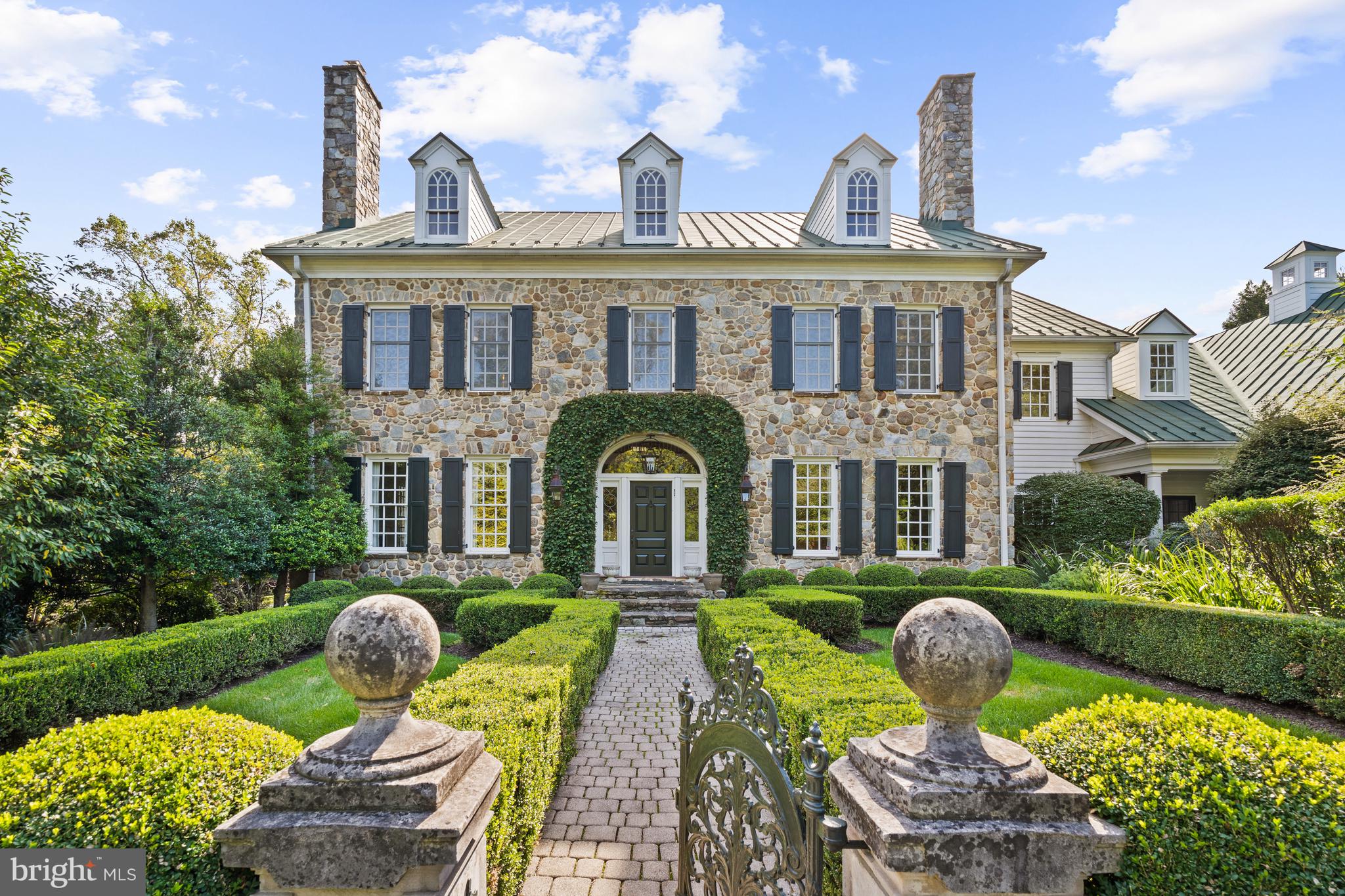 Open House Cancelled. Seller received compelling offer. 

Privately appointed on nearly 2 acres in the coveted McLean community, 8408 Parham Court presents an elegantly crafted 1997 Colonial encompassed by pristinely manicured gardens, mature trees and sprawling lawns. Inside the home’s stately fieldstone façade, soaring ceilings, magnificent millwork and exquisite design details are on display throughout the 10,150 square foot home’s 3 levels. 
<br>
<br>
Formal Living and Dining Rooms flanking the entry foyer and more informal Family Room, Solarium and Library appointed towards the rear of the residence. Adorned with numerous fireplaces, whether you’re hosting large-scale gatherings or enjoying the simplicities of day-to-day living, any guest is sure to feel at home. The heart of this enchanting residence resides in the noteworthy Gourmet Kitchen. Complete with high-end stainless-steel appliances, abundant counterspace, 3 wine refrigerators, a 6-burner gas range, two dishwashers, an adjacent Breakfast Room and a Butler’s Pantry encompass this Chef’s Kitchen. Covered porches and sprawling patios line the rear of the residence to offer the perfect place for alfresco dining overlooking the lush lawns and gorgeous gardens. A Laundry Room, complete with a Pet Shower, and a Mudroom are located on the Main Level and provide interior access to the oversized 3-Car Attached Garage. 
<br>
<br>
The Upper Level showcases the principal guest rooms to include an expansive Owner’s oasis. Boasting Cathedral Ceilings and a private Balcony overlooking the property’s breathtaking grounds. The Primary Suite features two gas fireplaces, a private Sitting Room, Wet Bar, and Dressing Area complete with two large and outfitted Walk-In Closets. The Primary Bathroom opens to reveal a luxurious soaking tub, stall shower, two vanities and two water closets. A large Upper-Level Family Room, 3 additional ensuite Bedrooms and extra storage closets complete the level’s offerings.
<br>
<br>
The fully finished, walkout Lower-Level debuts a sprawling In-Law Suite sure to delight any long-term guest. Featuring a private separate entrance, the Suite boasts a fully outfitted Kitchen with Butler’s Pantry, a Dining Room, Living Room, an ensuite Bedroom with multiple walk-in closets, a Laundry Room and a private Patio. The Lower Level is also equipped with a Home Theatre, Gym, Office Space with a Full Bathroom, and numerous Storage Rooms. 
<br>
<br>
Debuting a seamless synthesis of ageless design, luxurious comfort, and modern functionality, this 5 Bedroom, 7 Full Bathroom, 2 Half Bathroom abode exudes sophistication and serenity at every turn.
