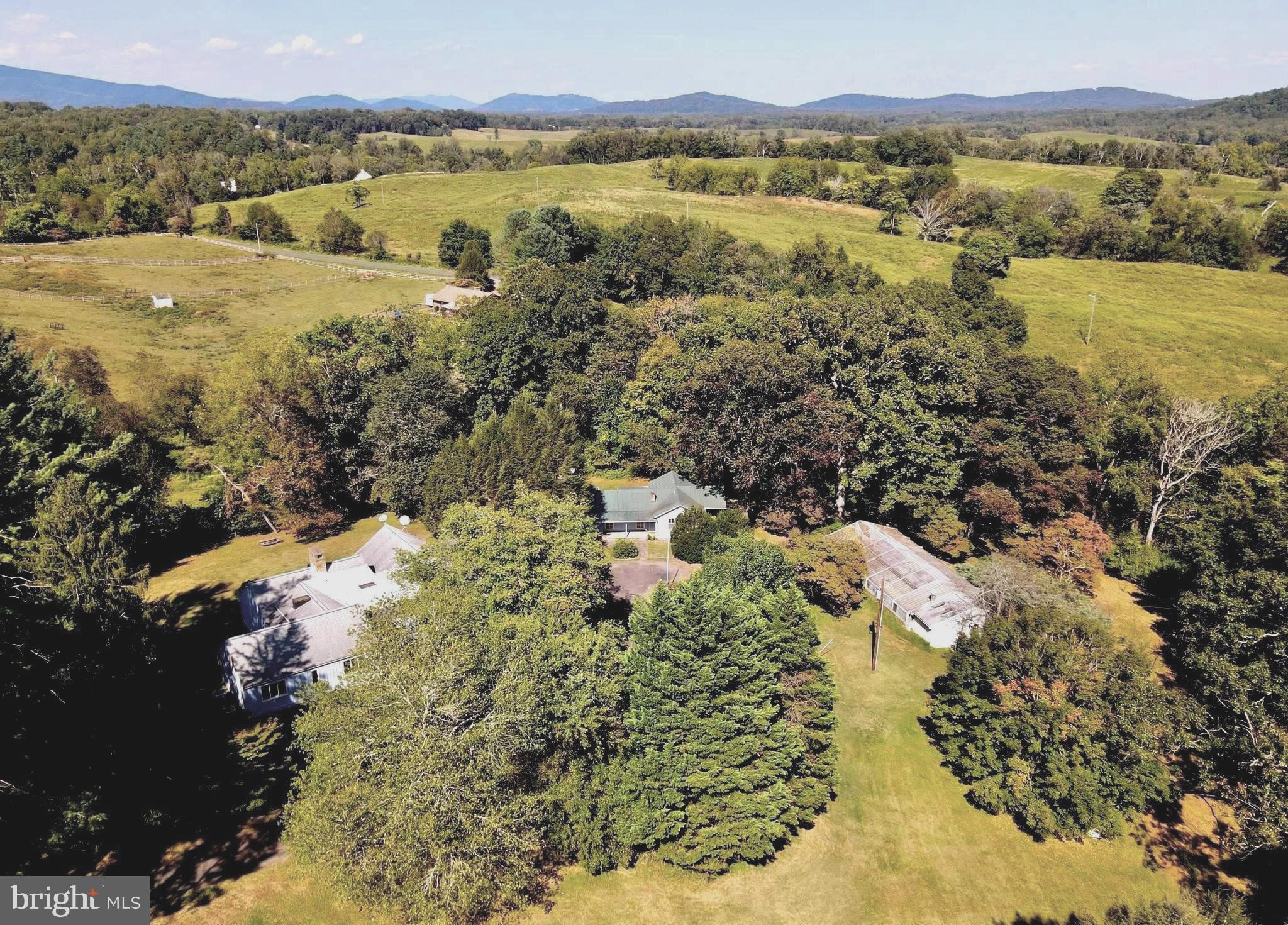 FANTASTIC OFFERING:  A HOME FOR ENTERTAINING, with  GUEST HOUSE &  INDOOR POOL.  Surprising package on 36 acres in the heart of  Rappahannock County.  The residence was created for entertaining with spacious rooms for art and displays, and once hosted President Reagan and dignitaries for a luncheon.  Guest house offers a beautiful living room-library and extra bedrooms.   Pool house offers a stone fireplace!  Ready for your personal and artistic touches to mold this interesting estate to the vision of your future.  In all,  a sturdy, ample, and intellectually interesting property in the heart of Rappahannock County.  Spectacular evening views of the Milky Way.  Close to the pleasantries of Sperryville and Shenandoah National Park.  A great place for families and friends to enjoy the best of country living about an hour west of the beltway.
