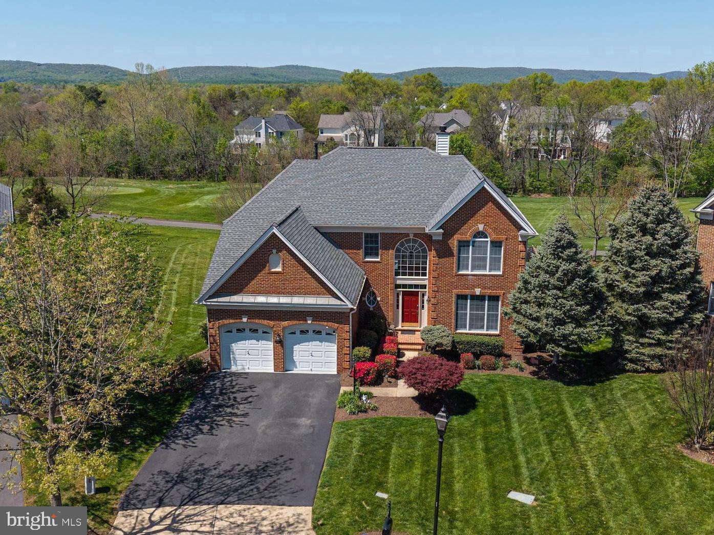*** Sellers accepted a sight unseen offer *** Ready to live where every day feels like a 5-star resort? If so- you just hit a hole in one! Located on a quiet cul-de-sac this stunning property offers panoramic views of the 3rd hole – your front-row seat to Dominion Valley’s championship golf course * Immaculately manicured landscaping * Over 5,300 sq ft * 5BR/4.5BA * Sun-filled grand 2 story foyer * Huge formal Dining Room with crown molding and chair rail * Contemporary gourmet Kitchen boasting professionally painted cabinetry, stainless steel appliances, center island and granite counter tops * A cozy Breakfast Nook perfect for casual meals * Designated Home Office * A rare and highly sought-after main-level Primary offering a sitting room, 2 walk-in closets and a large owner’s bath with a jacuzzi soaking tub * Jaw-dropping 2-story Family Room featuring a gas fire place and a wall of windows * Main lvl walk-in Laundry Room * Updated Powder Room * Gleaming wood floors * Upgraded light fixtures and ceiling fans, door knobs and hinges * Upstairs featuring a huge Princess Suite with a full bath and a large walk-in closet plus 2 secondary bedrooms and a hall bath * Fully finished walk-out basement offering a large rec room, a custom a wet bar, bedroom #5, a full bath plus extra storage * Maintenance -free deck * Paver patio * Irrigation * Fresh neutral paint (all 3 lvls) * New carpet (2024) * New water heater (2023) * Driveway repaved (2024) * 2 car front load garage with 50 receptacle (ready for a EV charger), garage opener (2022) and poly floor * New blinds throughout * World-class amenities: Arnold Palmer Signature Golf Course, renovated Clubhouse, state-of-the-art Sports Pavilion, 5 swimming pools including an indoor pool, tennis & basketball courts, playgrounds, miles of walking/biking trails and two fishing ponds * Award winning schools!