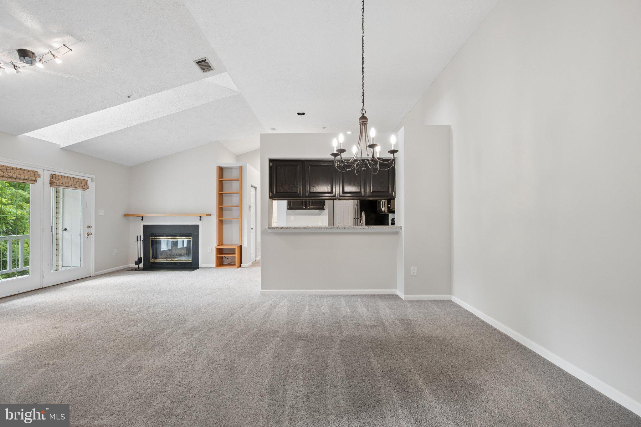Welcome home to this bright and inviting  top level 2-bedroom, 2-bathroom condo with skylights, vaulted ceilings and a cozy fireplace,  tucked into the sought-after Waters Edge at North Lake community, Just as short walk to Gunner’s Lake, this open-concept unit offers a comfortable, low-maintenance lifestyle with a highly functional layout: the living and dining areas are punctuated by two entirely separate bedroom areas, giving you and your guests room to breathe. The upgraded kitchen overlooks the dining space and includes stainless steel appliances, granite countertops and custom-stained and painted oak cabinets. Every room has a private, tree top view. Enjoy your morning and afternoon breaks on the private balcony, which includes a generous storage closet. 
Both bedrooms offer generous closet space with custom closet organizers, and an additional custom organizer in the hallway closet keeps everyday essentials neatly in place. The primary suite features its own private bath — ideal for roommates, guests, or a home office setup. An in-unit washer and dryer add everyday convenience, and a new, upgraded 2024 HVAC system means comfort and peace of mind for years to come.
Enjoy all the recreation community amenities including a lake,, tennis courts, tot lot/playground, and scenic jog and walking trails right outside your door. You can join the pool by becoming a member of the Northlake Foundation. The condo fee covers water, trash, snow removal, common area maintenance, and grounds care, making for easy, worry-free living.
Unbeatable location with quick access to Route 270, Route 355, the ICC, Shady Grove Metro, and MARC train, plus close proximity to Crown, RIO, Kentlands, and Germantown Town Center for shopping, dining, and entertainment.
