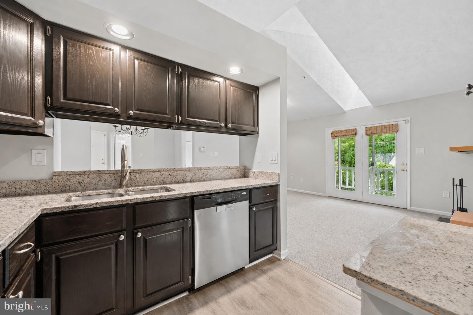 Welcome home to this bright and inviting  top level 2-bedroom, 2-bathroom condo with skylights, vaulted ceilings and a cozy fireplace,  tucked into the sought-after Waters Edge at North Lake community, Just as short walk to Gunner’s Lake, this open-concept unit offers a comfortable, low-maintenance lifestyle with a highly functional layout: the living and dining areas are punctuated by two entirely separate bedroom areas, giving you and your guests room to breathe. The upgraded kitchen overlooks the dining space and includes stainless steel appliances, granite countertops and custom-stained and painted oak cabinets. Every room has a private, tree top view. Enjoy your morning and afternoon breaks on the private balcony, which includes a generous storage closet. 
Both bedrooms offer generous closet space with custom closet organizers, and an additional custom organizer in the hallway closet keeps everyday essentials neatly in place. The primary suite features its own private bath — ideal for roommates, guests, or a home office setup. An in-unit washer and dryer add everyday convenience, and a new, upgraded 2024 HVAC system means comfort and peace of mind for years to come.
Enjoy all the recreation community amenities including a lake,, tennis courts, tot lot/playground, and scenic jog and walking trails right outside your door. You can join the pool by becoming a member of the Northlake Foundation. The condo fee covers water, trash, snow removal, common area maintenance, and grounds care, making for easy, worry-free living.
Unbeatable location with quick access to Route 270, Route 355, the ICC, Shady Grove Metro, and MARC train, plus close proximity to Crown, RIO, Kentlands, and Germantown Town Center for shopping, dining, and entertainment.