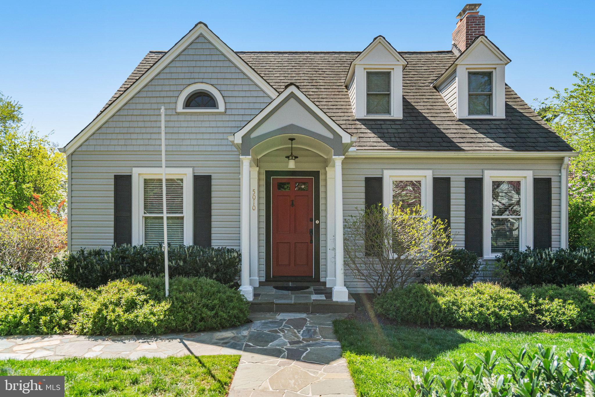 Beautifully updated and expanded, this 1937 Cape Cod blends classic Arlington charm with a gardener’s paradise, offering three finished levels, four bedrooms, two baths, and an oversized driveway—conveniently located just blocks from Ballston Metro, Westover Shops, and Custis /W&OD Bike Trail.  Set on nearly one-quarter acre enhanced by a deck and stone patio nestled among trees, shrubs and perennial gardens, the yard provides plenty of open space for private enjoyment or entertaining family and friends.  Step inside to a gracious foyer with 9-foot ceilings, rich moldings, elegant wainscoting, and a light-filled family room with bay window overlooking vibrant spring gardens. The kitchen features exotic granite, stainless steel appliances, generous counter space, and heated floors—also found in the first-floor bath. Etched double-pane windows add timeless character, while the thoughtfully designed main-level bedroom and bath enable multi-generational living. The versatile lower level includes a rec room and  laundry with new, smart washer & dryer,  ready to adapt as a workshop, playroom, or second kitchen.  Recent updates include a 2024 gas boiler, 2017 water heater, 2025 new carpet in LL and a roof with 50-year shingles (installed approx. 12–15 years ago).  Meticulously maintained and move-in ready for its next chapter!