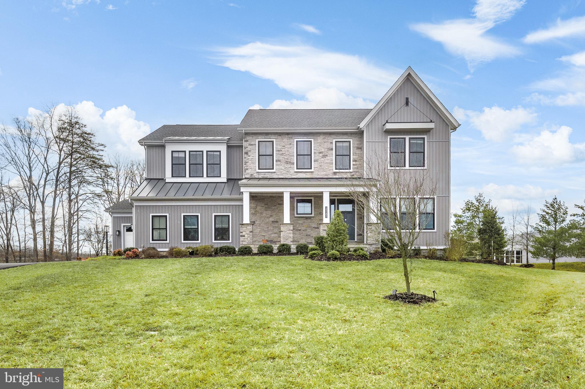 AMAZING OPPORTUNITY to own this LIKE NEW (2019) modern farmhouse.* Located within an award-winning gated golf community  of Dominion Valley Country Club, featuring resort-style amenities and a renovated clubhouse, this residence offers luxury living at its finest.* Ideally located at the end of a cul de sac you will immediately be WOWED by the STUNNING first impression with defined board and batten siding, stone accent, front porch, steep gables and metal roofing accents*The Reston Farmhouse model, situated on a premium .66-acre offers amazing privacy from other homes*The charming front porch with custom landscaping welcomes you into a realm of refined living. Offering three fully finished levels, 5 bedrooms, 5.5 baths, and 6,475 square feet of living space, this home is designed to meet the highest standards.Soaring 10-foot ceilings grace the main level, leading to a formal dining room or living room adorned with crown molding and updated light fixtures. The chef's kitchen boasts ample counter and cabinet space, upgraded GE Profile appliances, and a dramatic quartz backsplash. An expansive center island and a butler's pantry cater to culinary enthusiasts and entertainers. The sunlit breakfast area offers picturesque views of the permanent conservation area, while the great room, featuring a gas fireplace and wood mantel, seamlessly extends to an enclosed outdoor living space.The upper level features a luxurious primary bedroom suite with a spa-like bathroom and expansive walk-in closet. Additional highlights include spacious secondary bedrooms, a central loft, an upper-level laundry room, and a fully finished walk-up basement with 9-foot ceilings and a custom bar with a wine refrigerator. Outdoor amenities include a Trex deck, paver patio, and professionally landscaped yard. A whole-house water filtration system, WIFI thermostats, and CAT 6 internet cable exemplify modern luxury living at its finest.I would be happy to provide additional information or schedule a viewing at your convenience.  This home is a MUST SEE and will not last long.