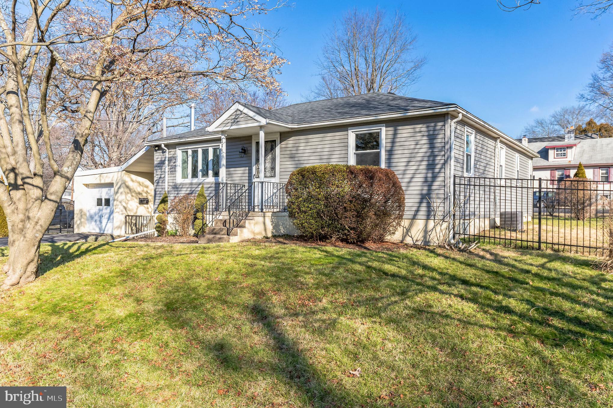 Located in Horsham Township of Montgomery County, this 1950s ranch style home has 3 bedrooms, 2.5 bathrooms, and just over 1,100 square feet of living space. With numerous upgrades over the last several years, this home has been lovingly maintained and move-in ready.  As you enter the home through the front door, you will immediately notice the open floor plan and beautiful laminate plank flooring that runs throughout most of the main living level. The living room is in the front of the home and has a large 3 panel window bringing in lots of natural light. Adjacent to the living room, against the back portion of the main living space is the kitchen, which features tile flooring, stainless steel appliances, granite countertops, and a tiled backsplash. On the right side of the home are three spacious bedrooms. The main bedroom has an updated full bathroom, featuring a stall shower and single sink. The full bathroom in the hall includes a tiled shower/tub and single sink. Down just a few steps, on the left side of the home is a small breezeway that provides access to a half bath, the one-car garage, full unfinished basement, and the back patio. The back patio is extensive, with plenty of space for outdoor dining or patio furniture, with a portion that is covered for use rain or shine! The fenced backyard is flat and open, perfect for a garden or playset. The full, unfinished basement is where you will find the laundry appliances and provides plenty of additional space for storage. Other great features of this home include a 1 car garage, public water and sewer, central A/C, within the Hatboro-Horsham School District, and just minutes from the PA Turnpike for easy access in and out of the area. Per PECO gas line map, a natural gas line runs along Cottage, and has a high probability of future connection if desired.