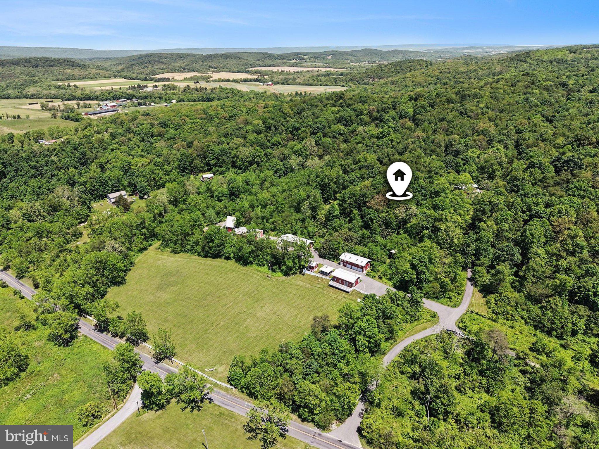 Discover an exceptional opportunity to own this 43+/- acre self-sustaining estate at 1339 Spruce Hill Road, Port Royal, PA 17082. Previously operated as a self-sustaining farm, this versatile property blends rural serenity with modern amenities and off-grid capabilities, featuring mature timber, electrified pastures, and proximity to Raystown Lake, Penn State University, and Harrisburg. Ideal for nature enthusiasts, families, or those seeking a private compound, with furnishings included.  
The campus includes 13 maintenance-free buildings, all connected via conduit, air-conditioned, and heated with four redundant systems for reliability. Key structures encompass the owner's house as the primary full residence; and two apartments serving as additional full residences for guests or family and equipped with washers and dryers; a two-story playhouse with solar lighting; a bath house fully equipped with a bath, washer, and dryer for campers and guests; a workshop with four full bays, high ceilings, a four-season wash bay, and air conditioning; a multi-level barn for storage with apartment, electric doors, baths, washers, and dryers; a cart shed for ATV storage with electric doors; a bike shed for bicycles; an eight-bay run-in shed (four lockable) for equipment and boats, including fuel tanks; a covered gazebo for outdoor dining; a woodshed holding approximately 10 cords of seasoned wood; and an equipment shed for property support. All living quarters are fully heated and cooled year-round, with additional indoor features like parking for over 20 cars, and three houses in total.  
Designed for self-sufficiency and recreation, the property spans groomed grounds in a low-density area, boasting two solar arrays, a 16 kW propane generator, a 2,000-gallon tank farm, approximately 1,000 gallons of diesel fuel storage with electric pumps, an electric/propane-driven air compressor system, three wells (one pneumatic, two electric), and two approved septic systems to ensure off-grid capability. 
Outdoor amenities include two electrified pastures, a 100-yard rifle range, a groomed camping area with two camper sites equipped with electric, phone, and cable for live-in workers, a quarry with stockpile, and a 5,000 sq. ft. fenced garden with a frost-free hydrant. Security and connectivity are enhanced by an electric gated entrance, a closed-circuit video system with remote access, three antenna arrays, a commercial central phone system with PA and paging capabilities, paved driveways, groomed cart paths, and indoor parking and wash bay.  
Additional perks make this low-maintenance haven even more appealing, with low taxes, affordable utilities, and a prime location just 30 miles east of Penn State, less than an hour from Harrisburg, and close to abundant outdoor adventures. Whether envisioned as a family estate, wildlife sanctuary, or investment property, this one-of-a-kind retreat offers privacy, functionality, and endless potential—schedule a showing today!
